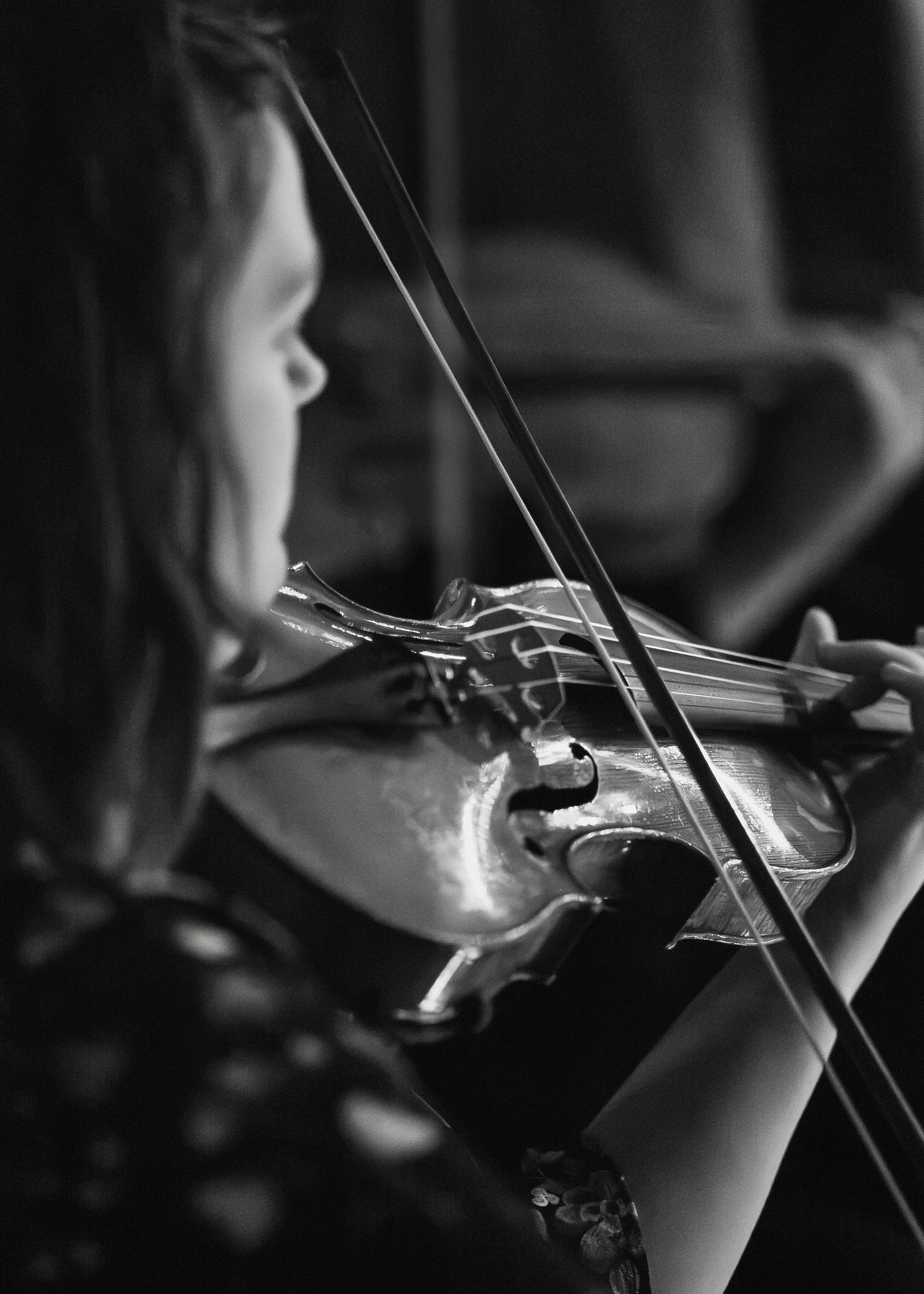 Concert Photograph by Photographer Arthur Hall. 
Black and white, Female Musician, Concert Photography, Violin.