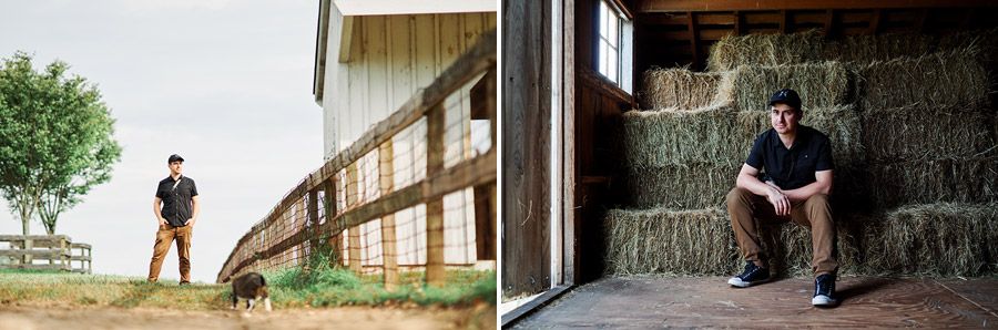 Man standing by barn fence and sitting on hay bales in a rural farm setting.