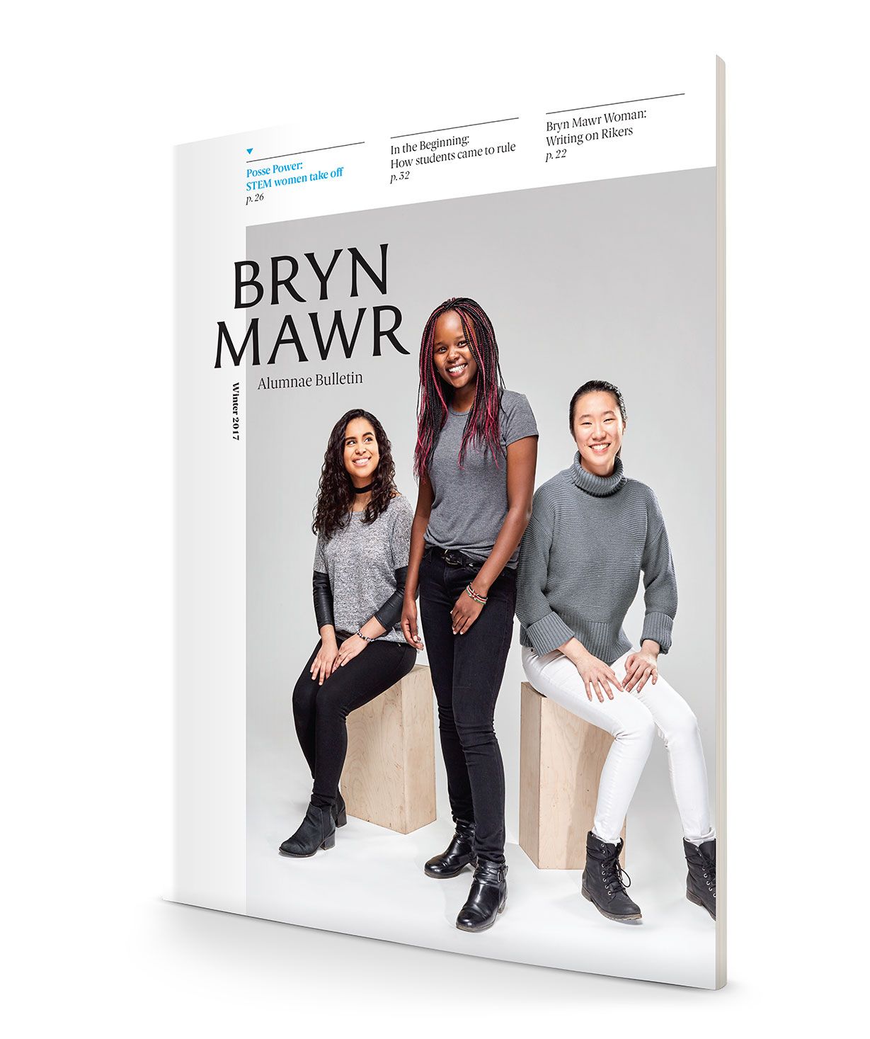 Bryn Mawr Alumnae Bulletin magazine cover featuring three diverse young women standing and sitting on white cubes.