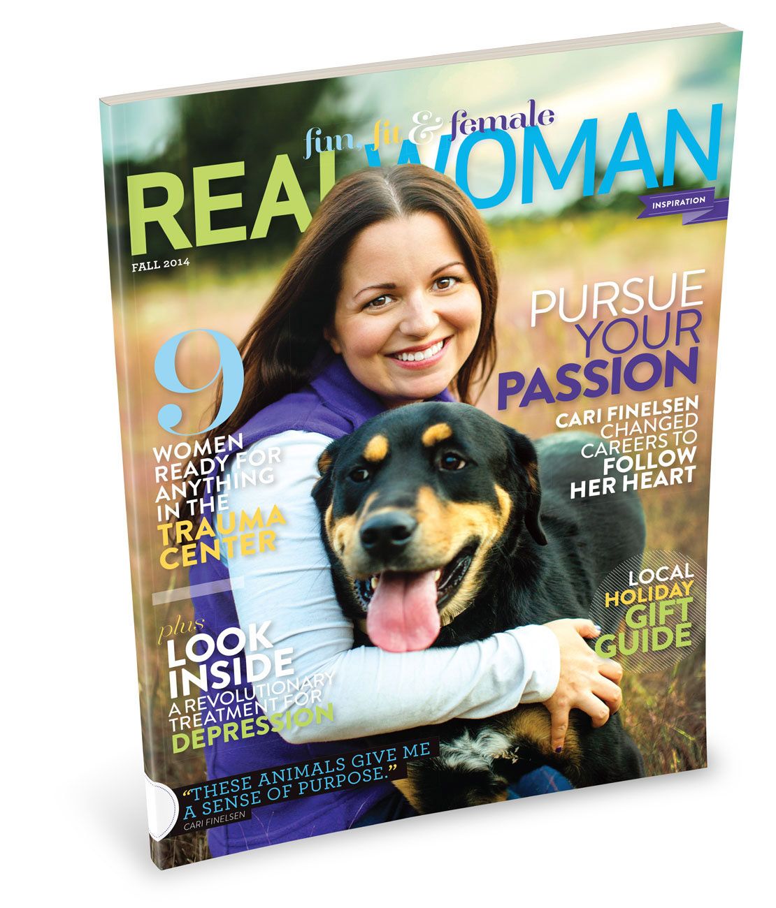 Real Woman magazine cover featuring a smiling woman hugging a black and tan dog titled Pursue Your Passion.