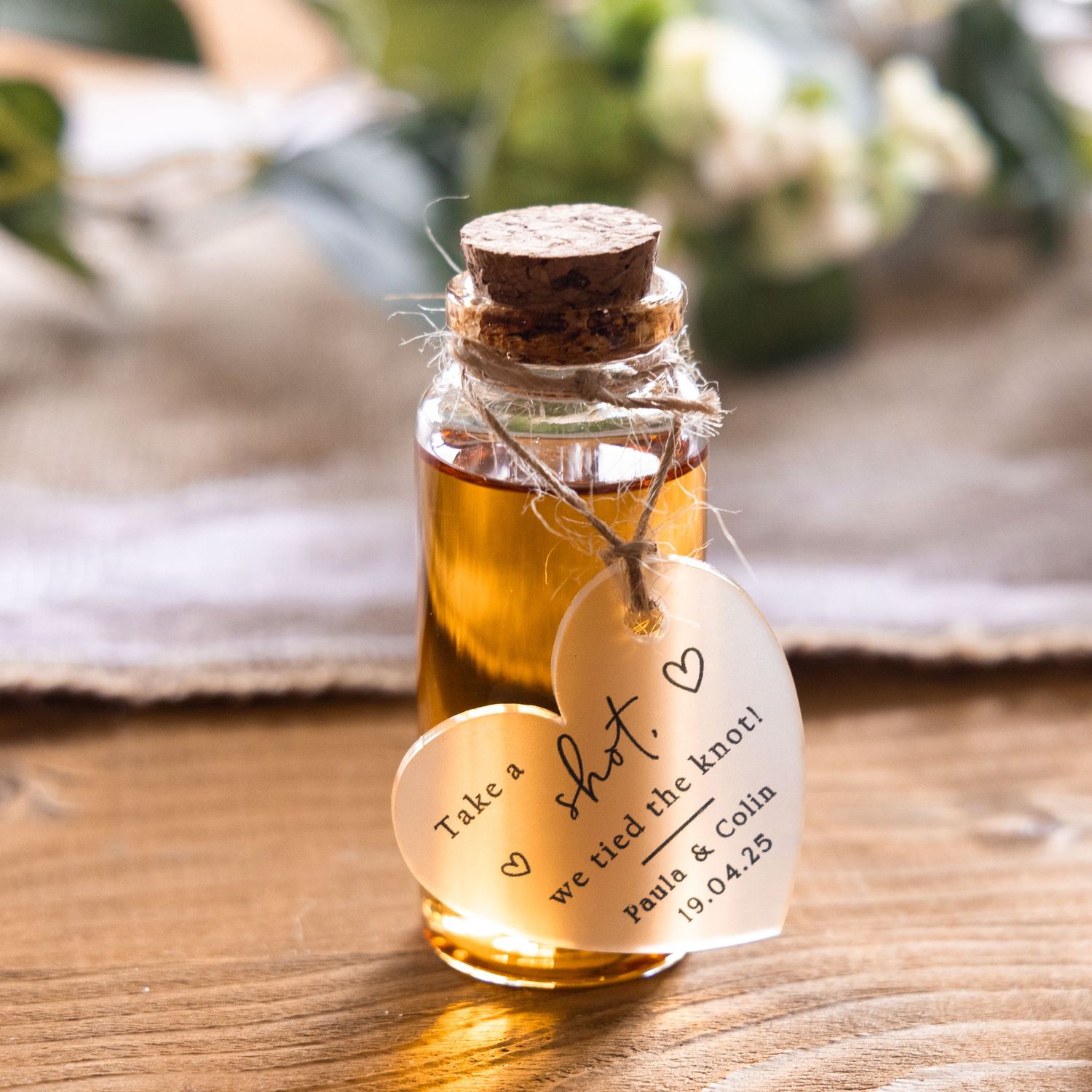 Rustic wedding favor mini bottle with cork and heart tag reading take a shot we tied the knot.