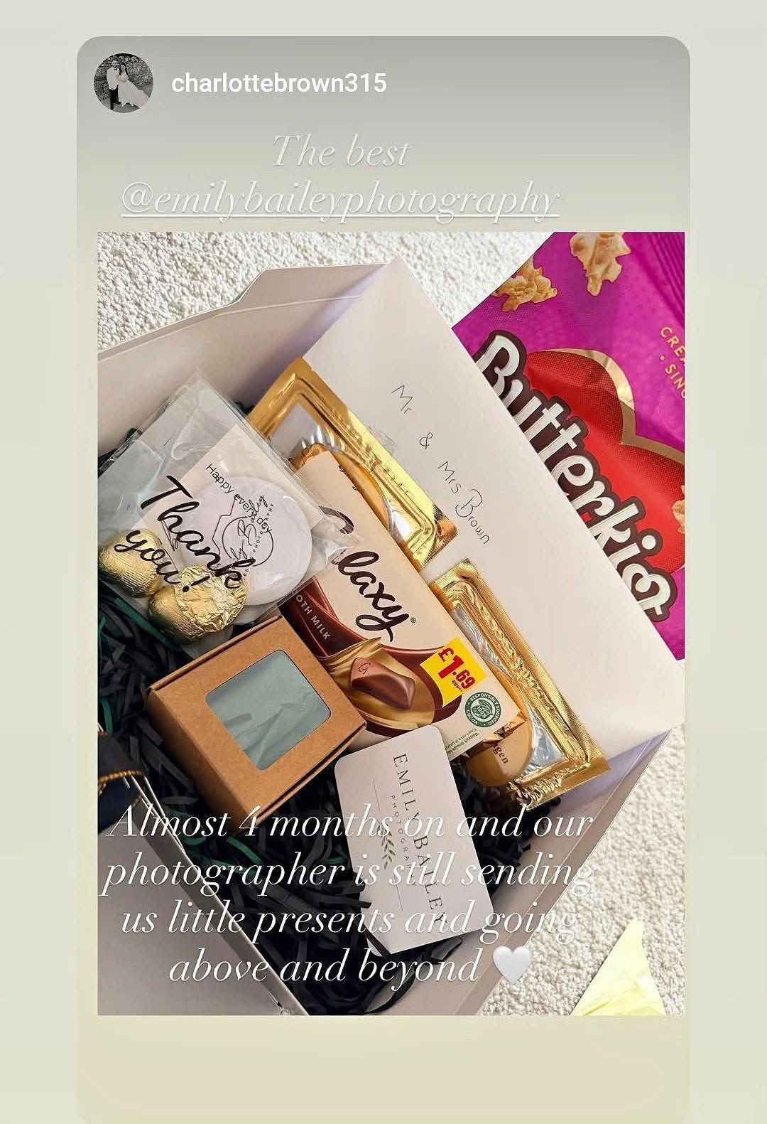 A gift box filled with treats, candles, and snacks sent by a wedding photographer to clients, showcasing exceptional customer service.