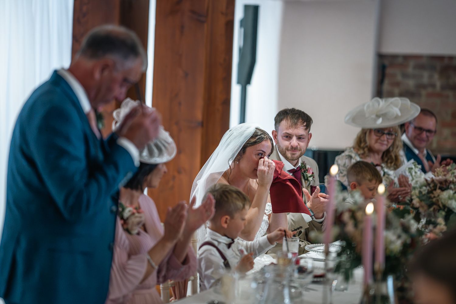 Bride emotional during speeches at her wedding at The Barn at Willerby Hill, Taken by an East Yorkshire wedding photographer