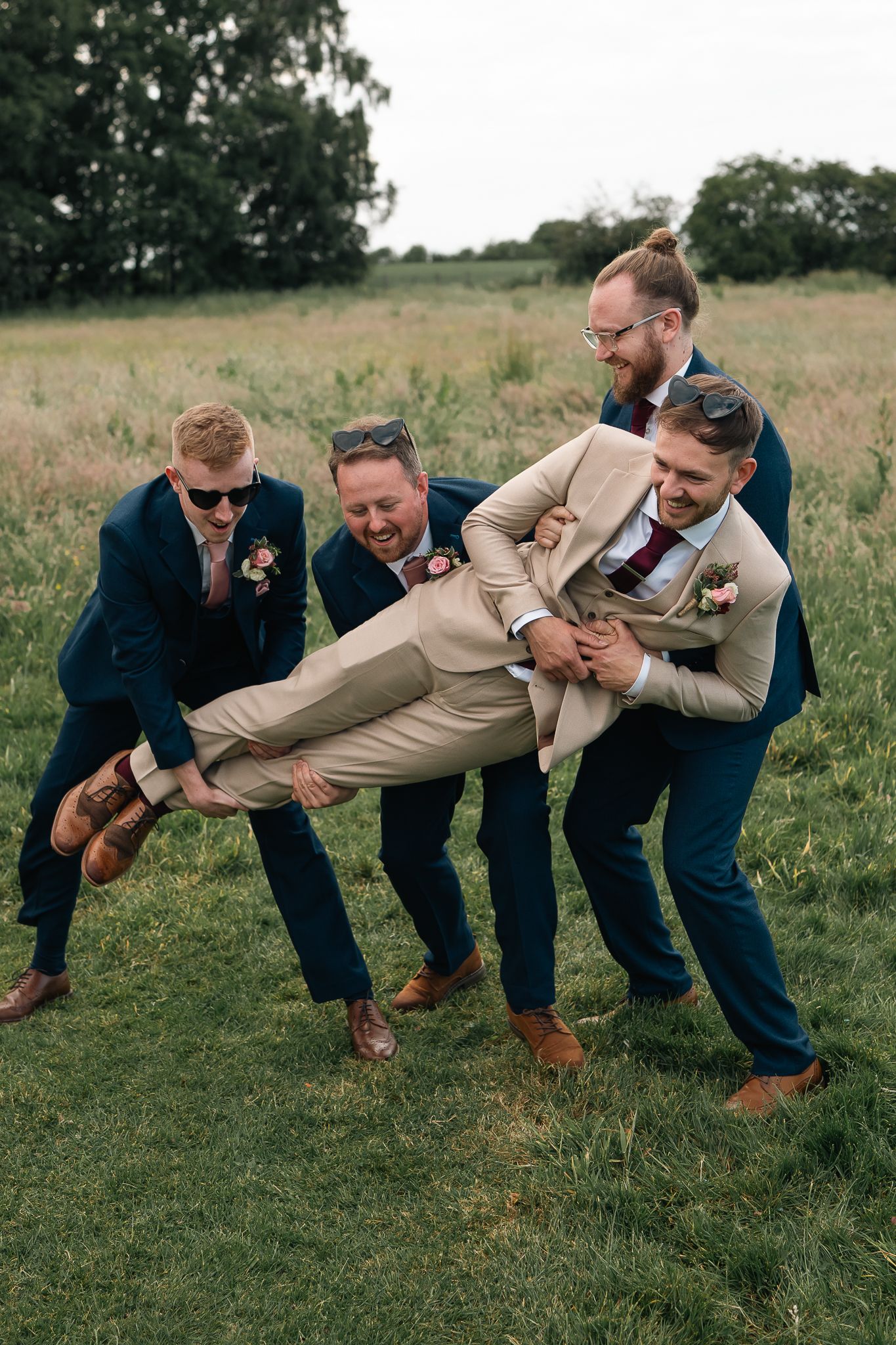Groom and groomsmen during the reception at The barn at Willerby, East Yorkshire, Taken by an East Yorkshire wedding photographer