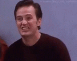 Man makes exaggerated grimacing expression in scene from popular TV sitcom Friends.