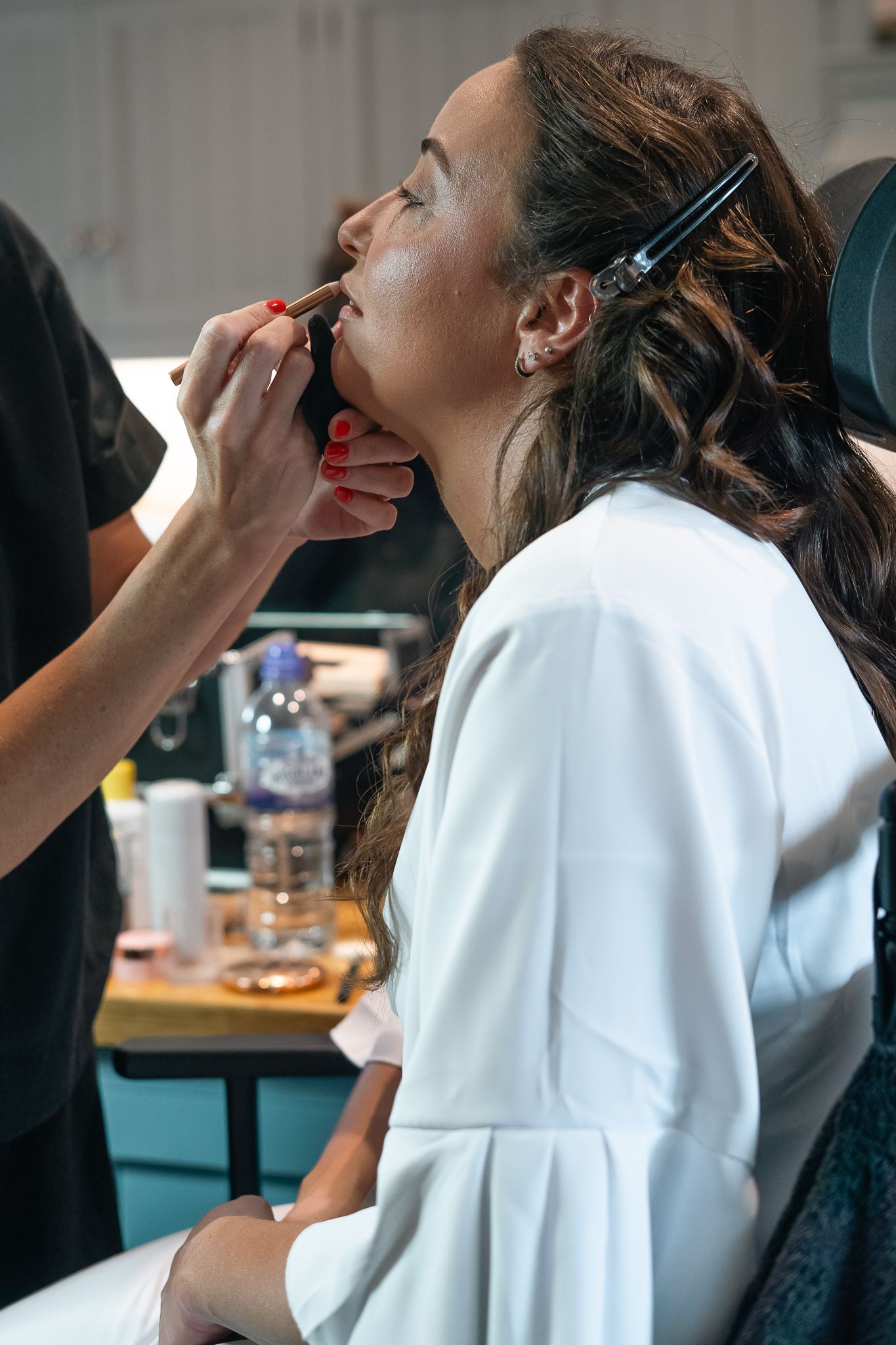 Bride having her makeup done during the preparations in East Yorkshire, Taken by an East Yorkshire wedding photographer