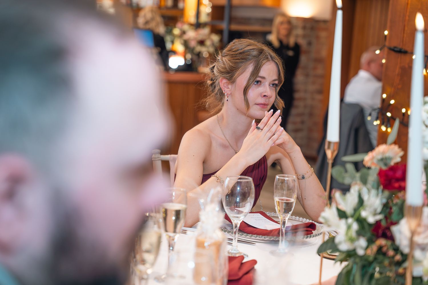 Bridesmaid emotional during speeches at her wedding at The Barn at Willerby Hill, Taken by an East Yorkshire wedding photographer
