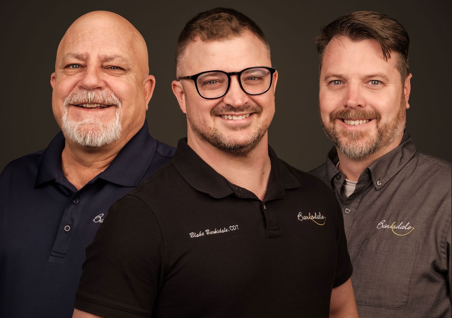 Professional team headshots of three men with consistent studio lighting and background, photographed for a business team in Madison Alabama