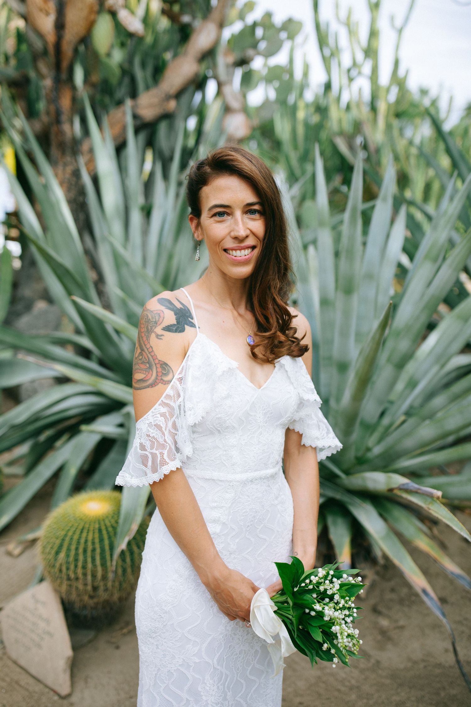 Bride portrait surrounded by greenery, captured in a documentary style