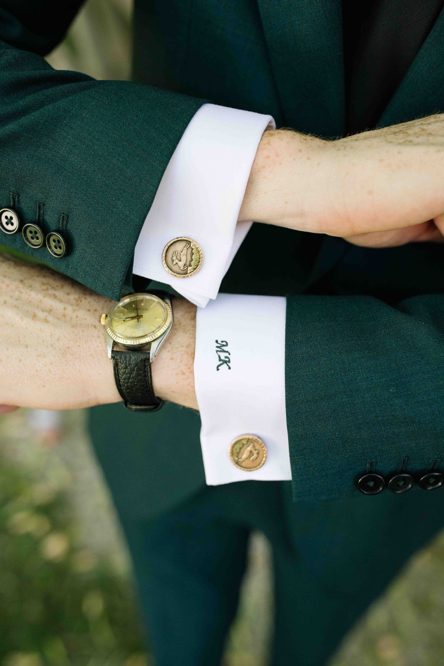 Close-up detail of groom's cufflinks during wedding day preparations