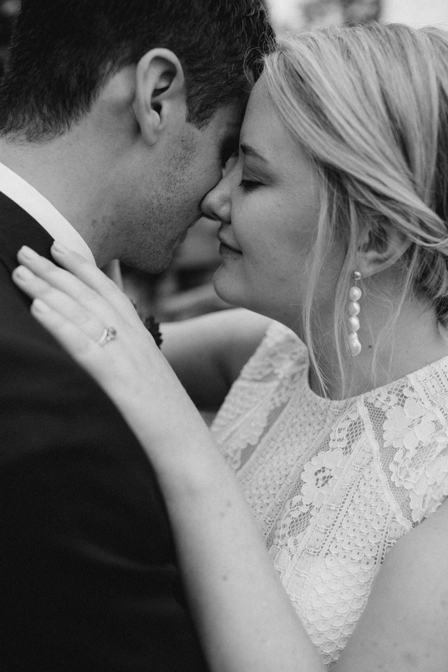 Quiet, emotional moment between a bride and groom captured up close