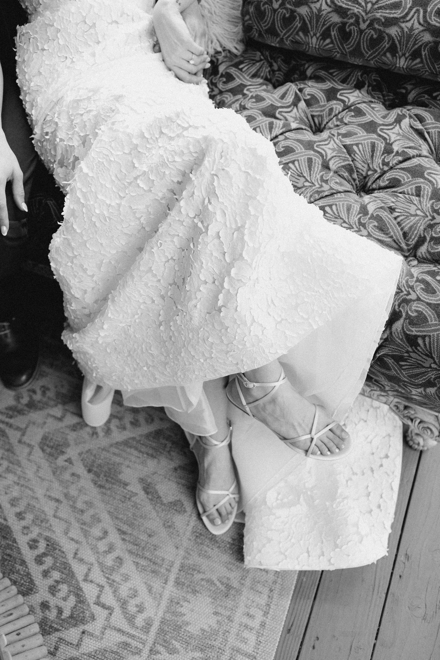 Close-up detail of wedding dress fabric captured in a documentary style
