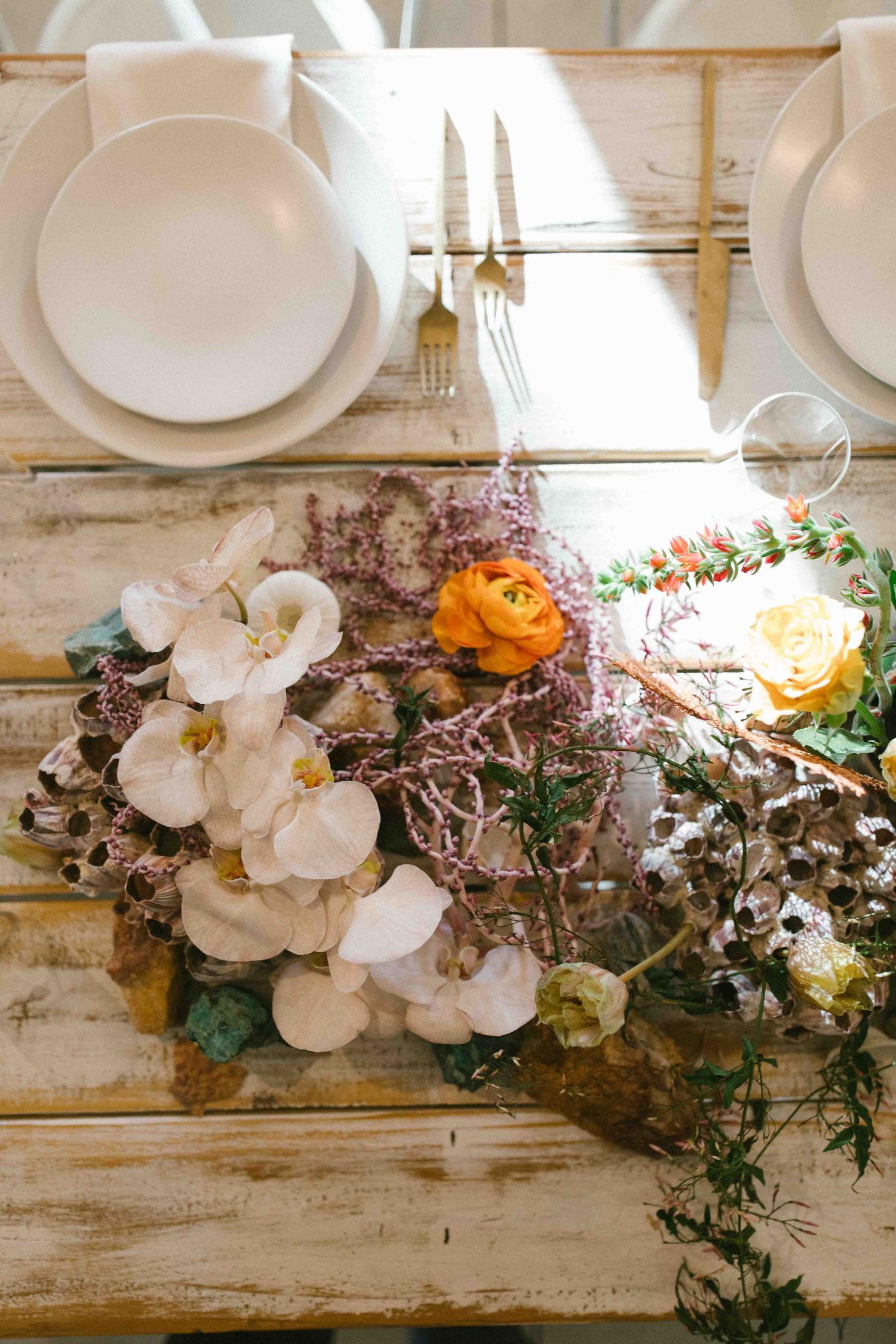 Wedding table setting with floral arrangement and place settings