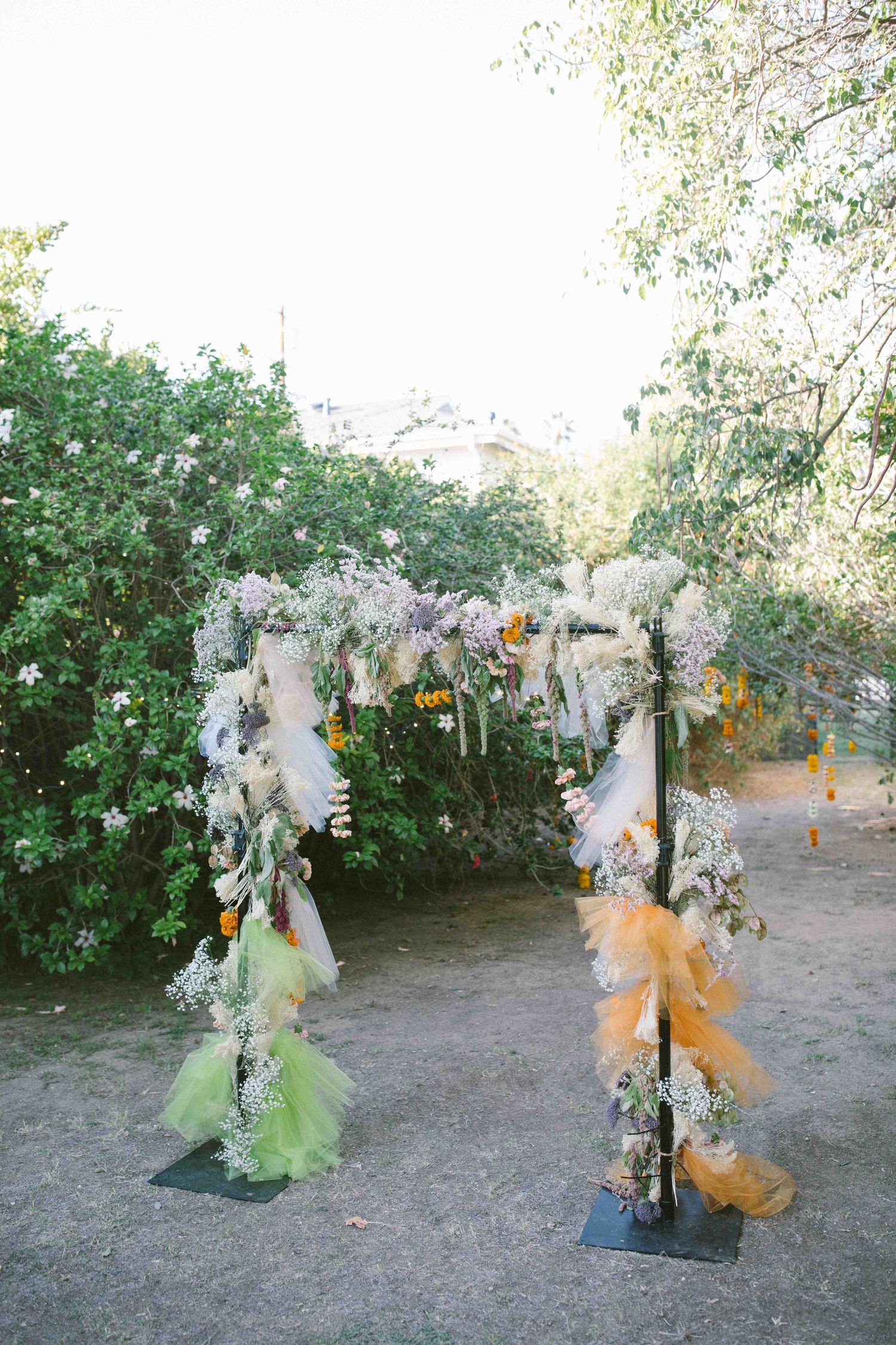 Wedding outdoor celebration ceremony area decorated with flowers