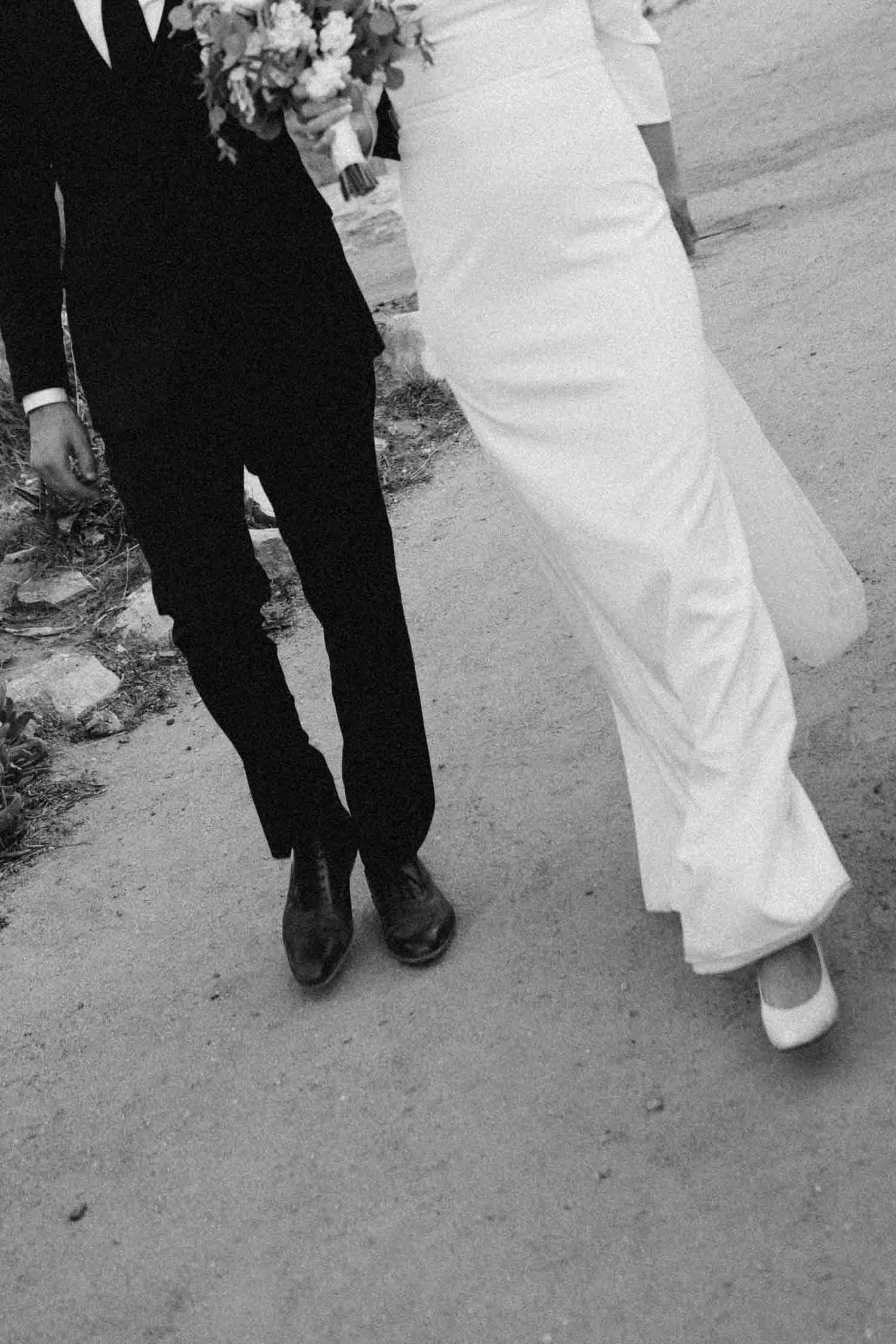 Documentary close-up of a couple walking together on their wedding day