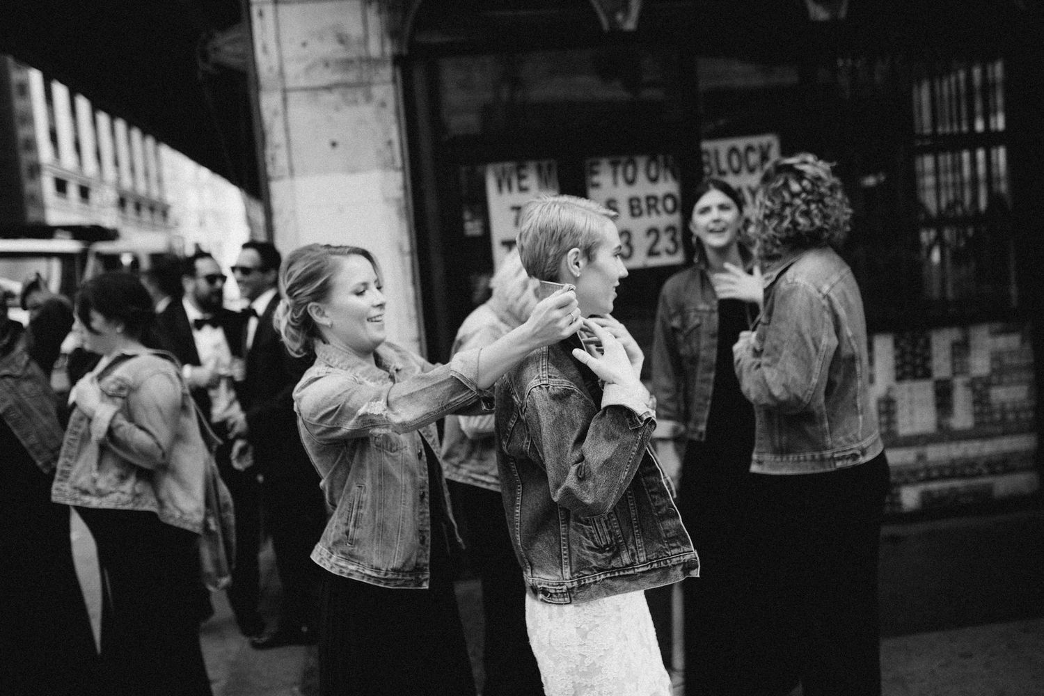 Candid reaction of wedding guests celebrating during the ceremony