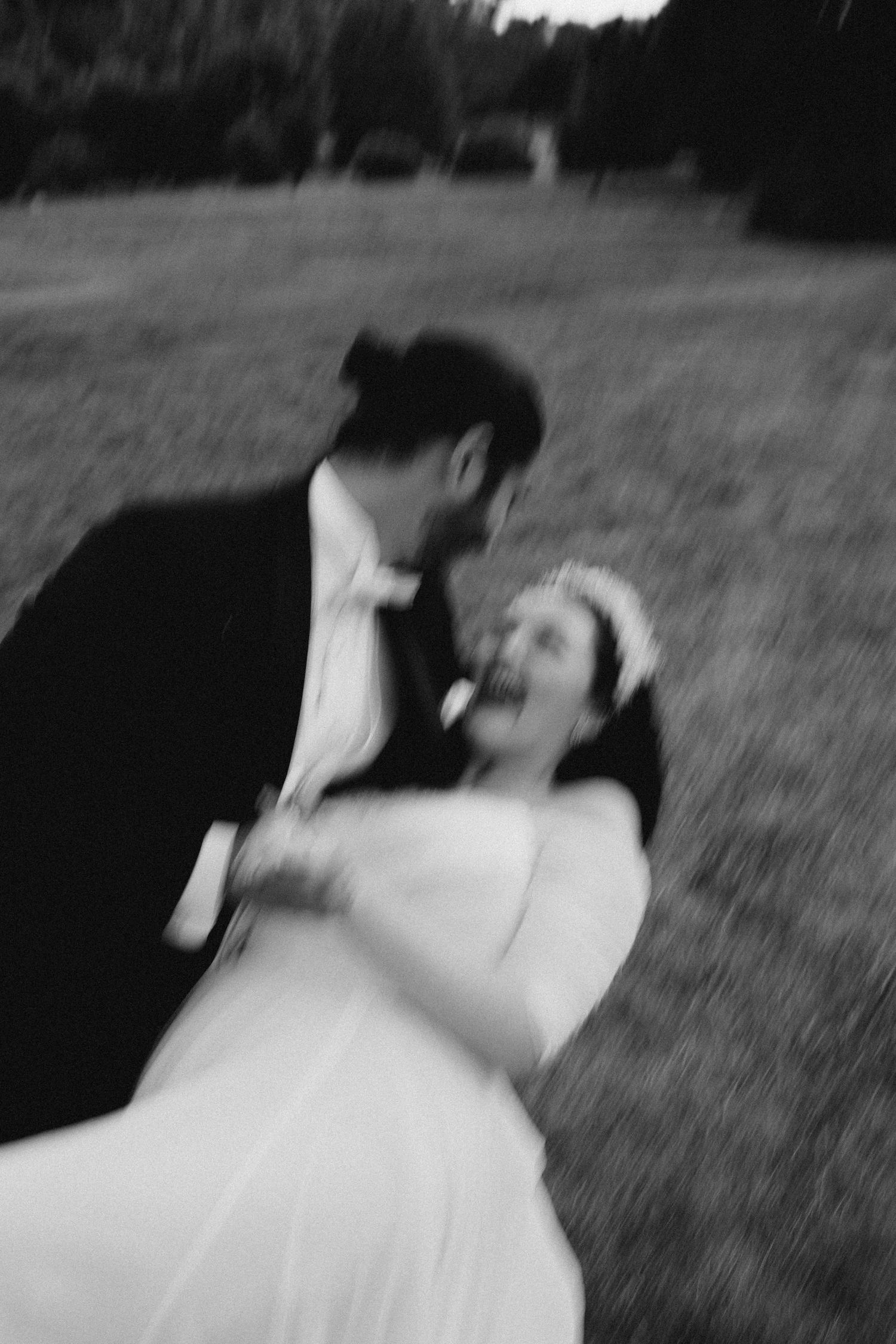 Soft, intimate documentary moment of a couple embracing outdoors