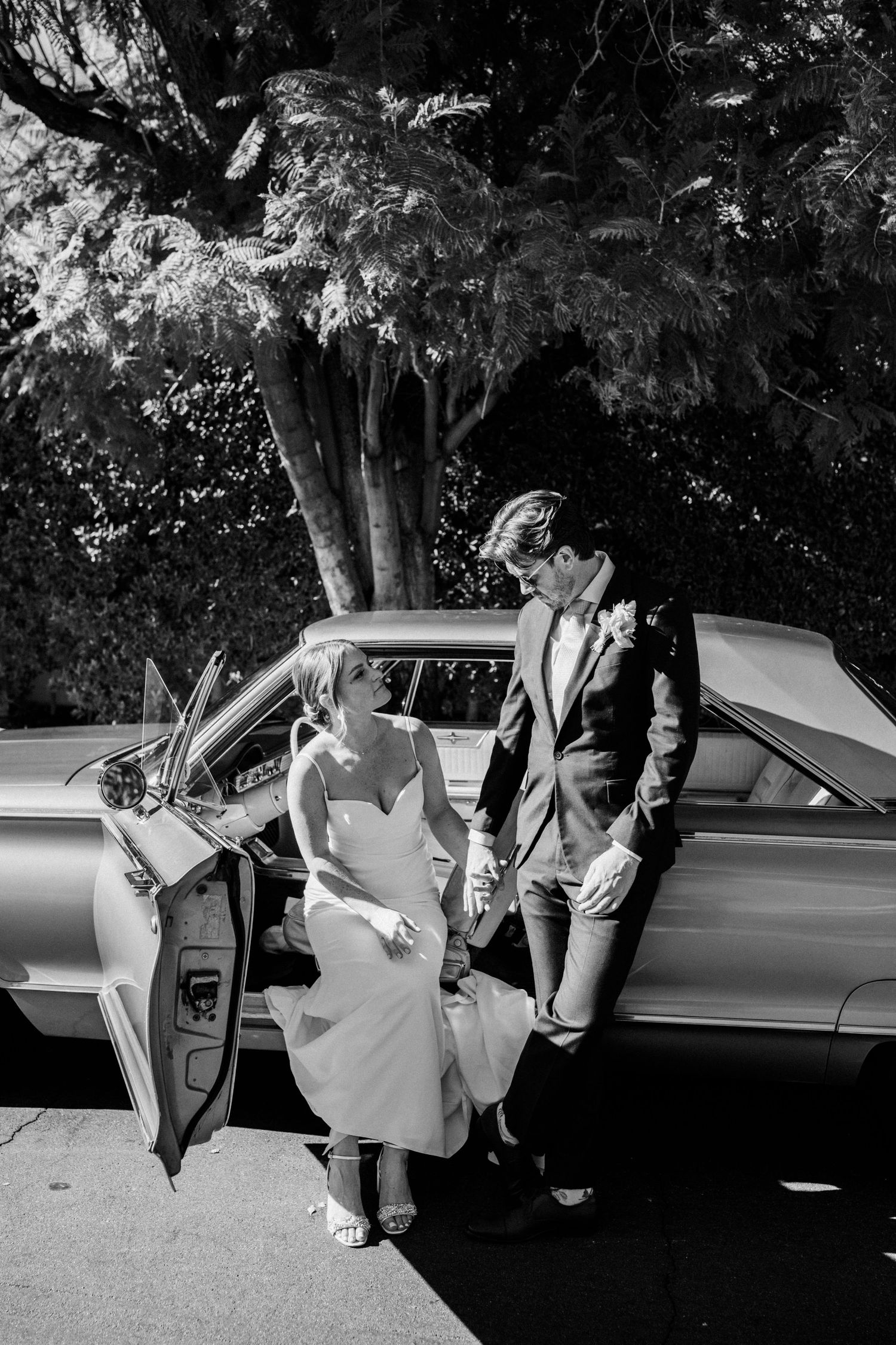Documentary moment of a bride sitting in a car
