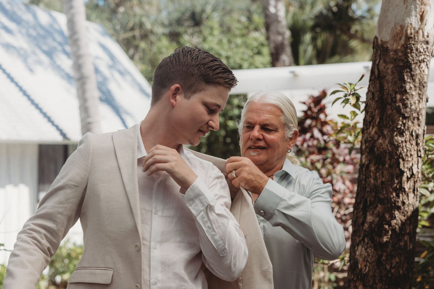 Candid emotional reactions during an outdoor wedding ceremony.