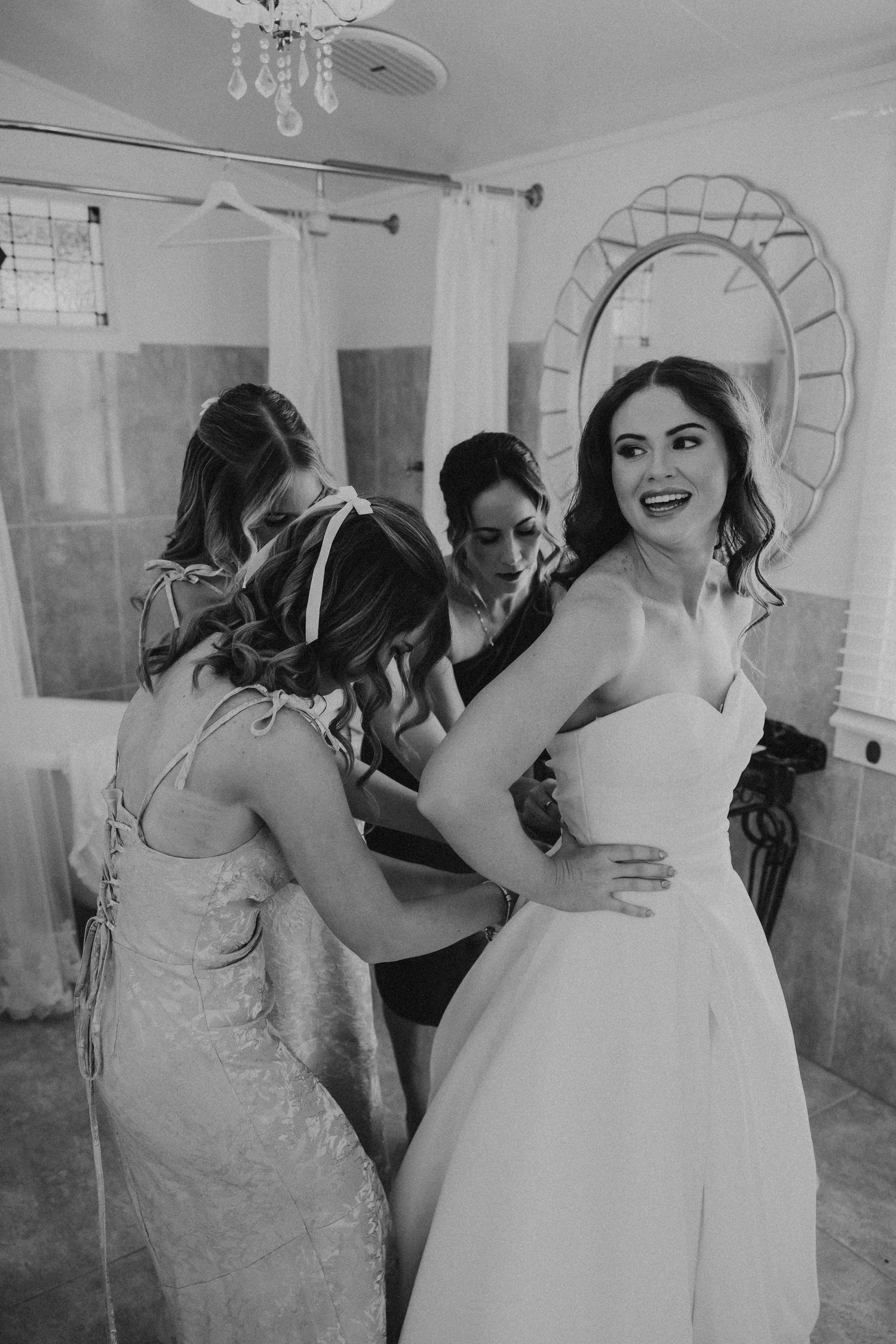 bridesmaids helping bride into dress emotional wedding moment Central Queensland wedding