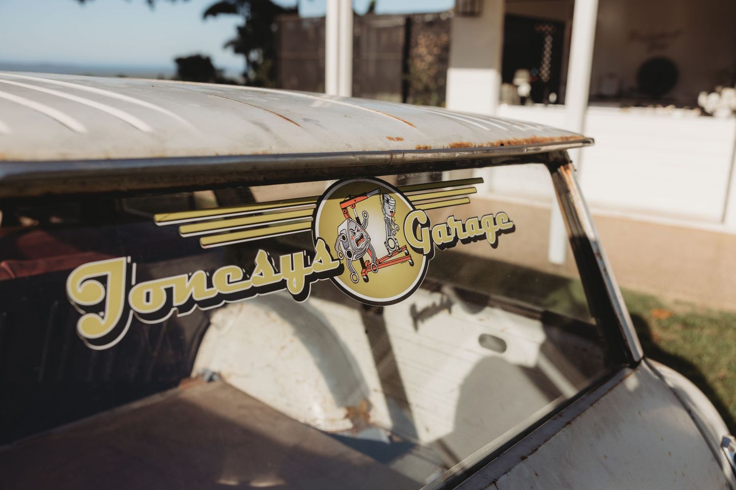 Close-up detail shots of gold lettering on a vintage car.