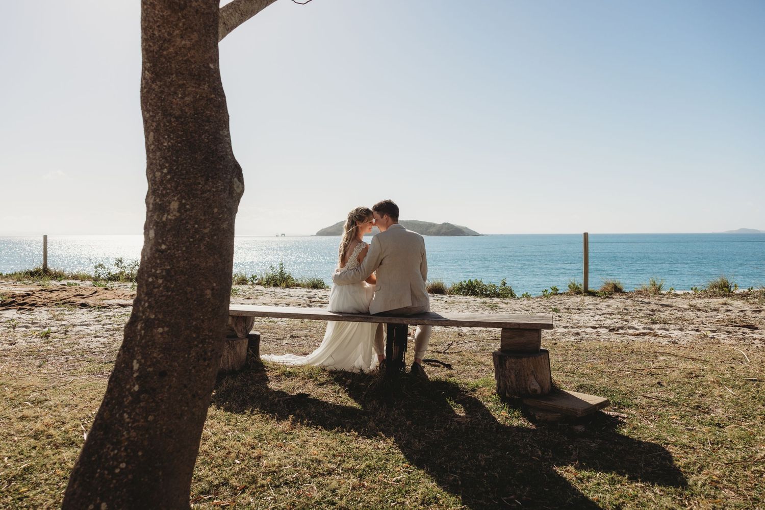 Scenic beachside wedding ceremony setup with ocean views and natural lighting.