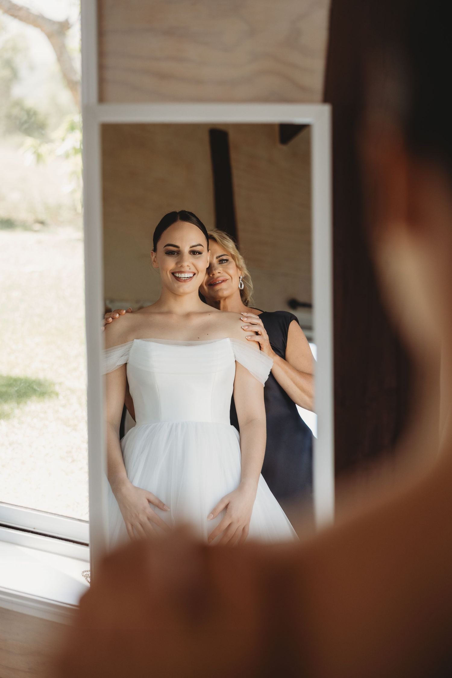 Wedding preparation moments captured in soft natural light.