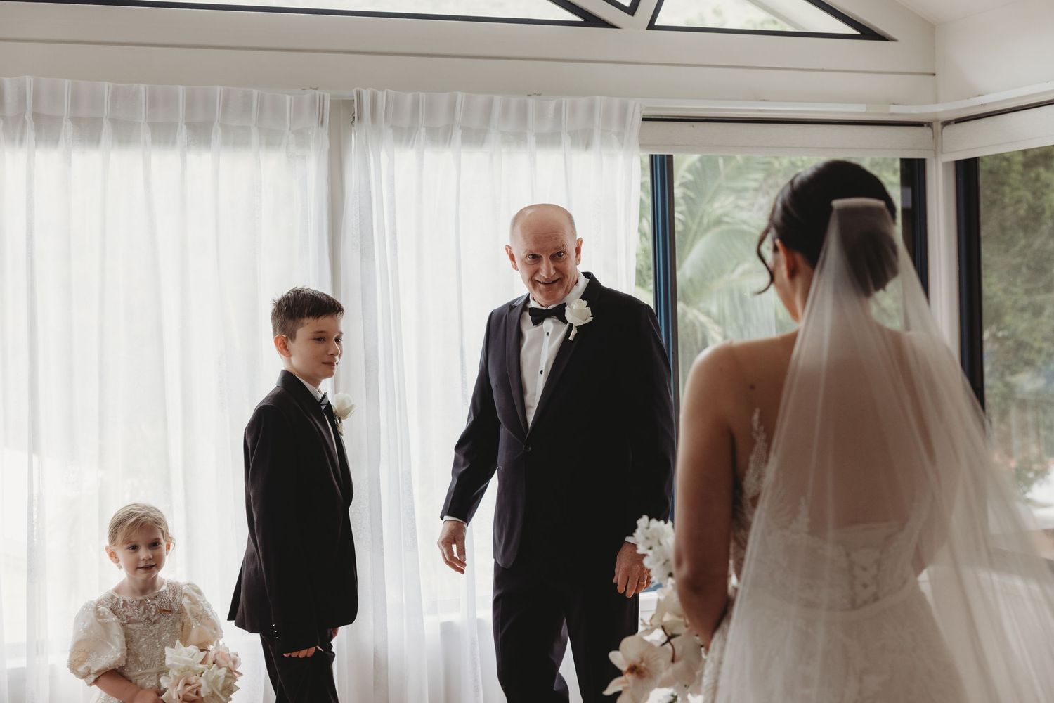 A series of intimate wedding ceremony moments shown in black and white photographs.