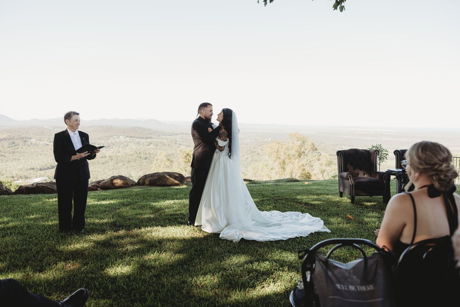 Wedding ceremony photos showing couples in formal attire during an outdoor celebration in a grassy field.