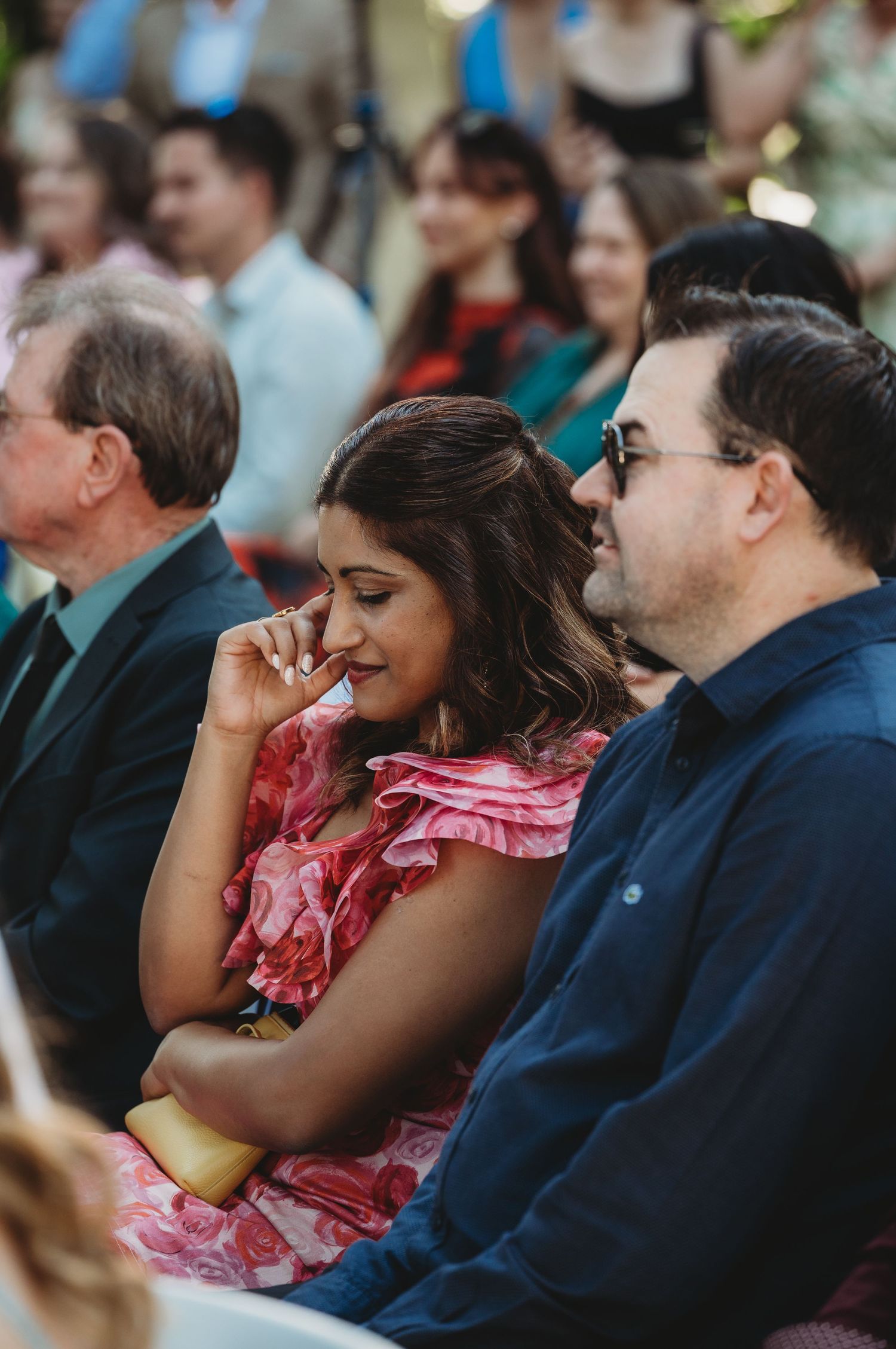 Wedding guests watch the ceremony with emotional expressions Central Queensland WEdding