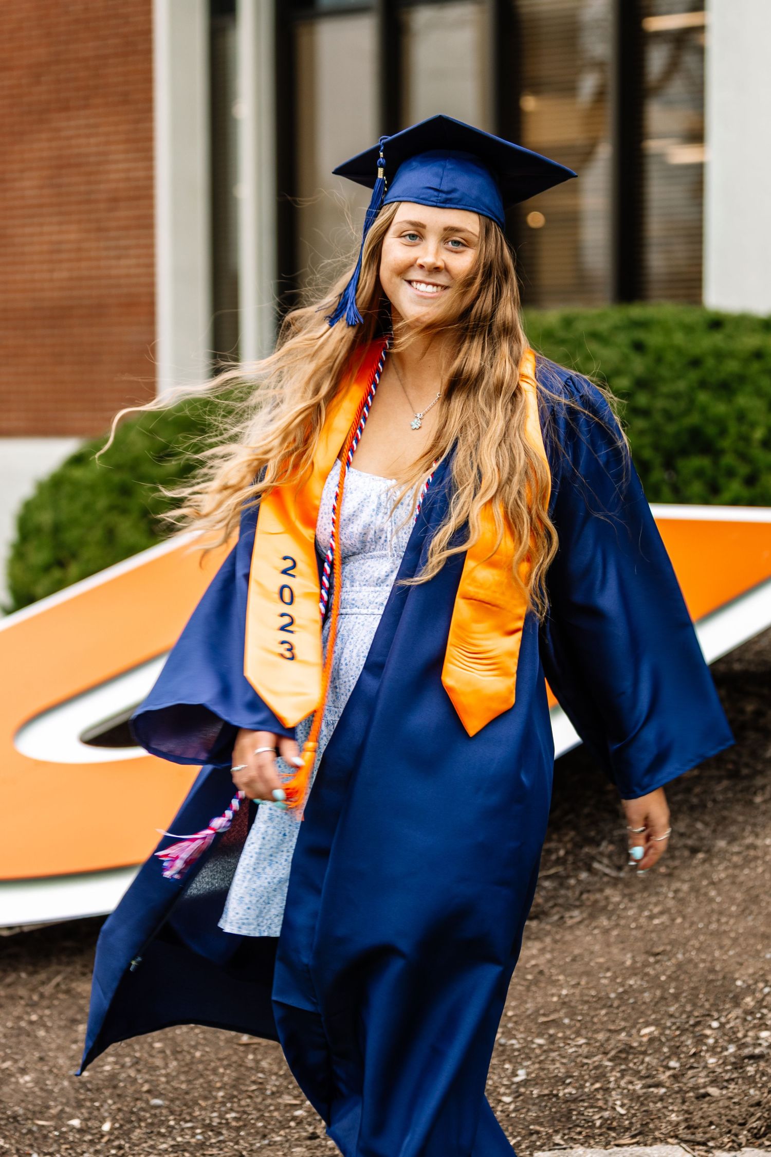 Girl wearing graduation cap and gown