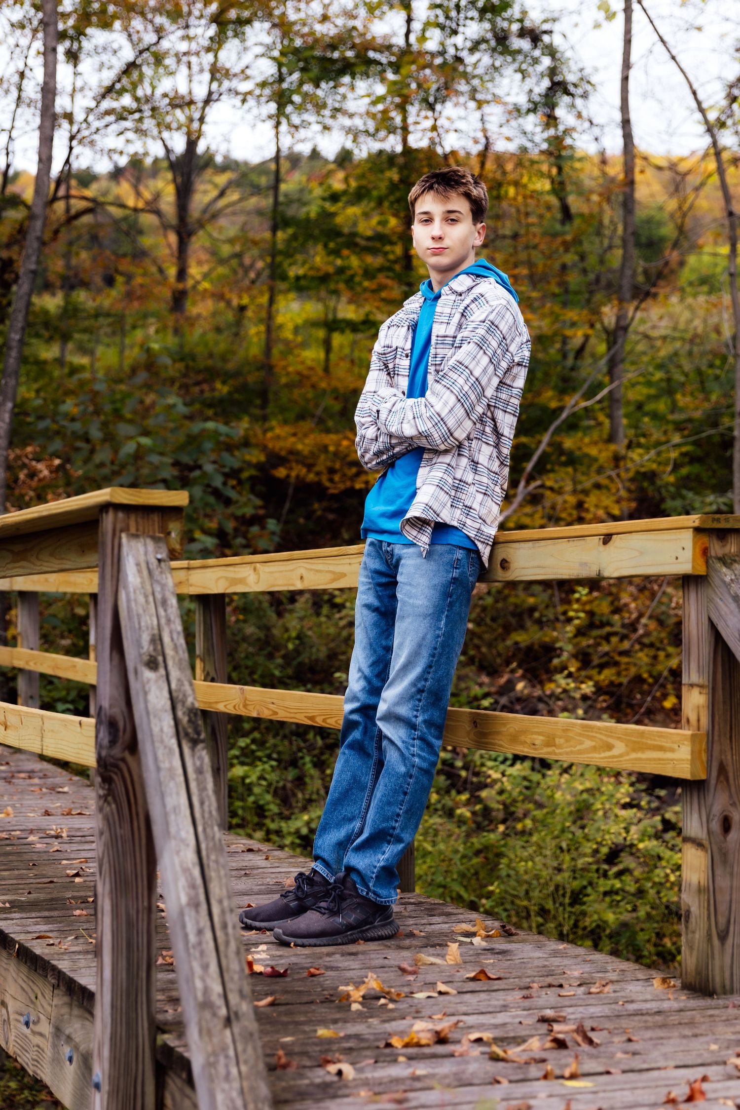 Boy leaning on bridge