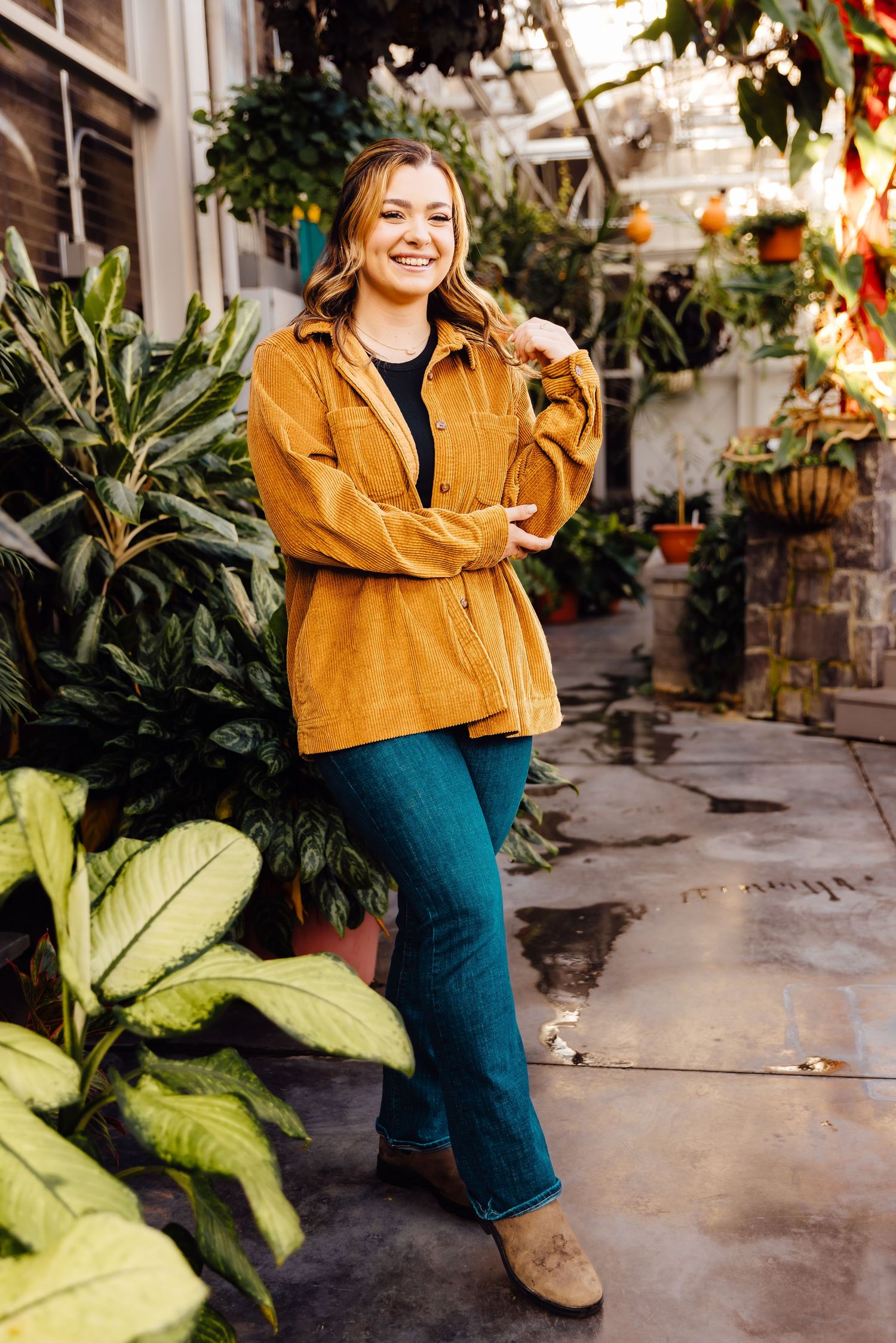 Girl posing in greenhouse
