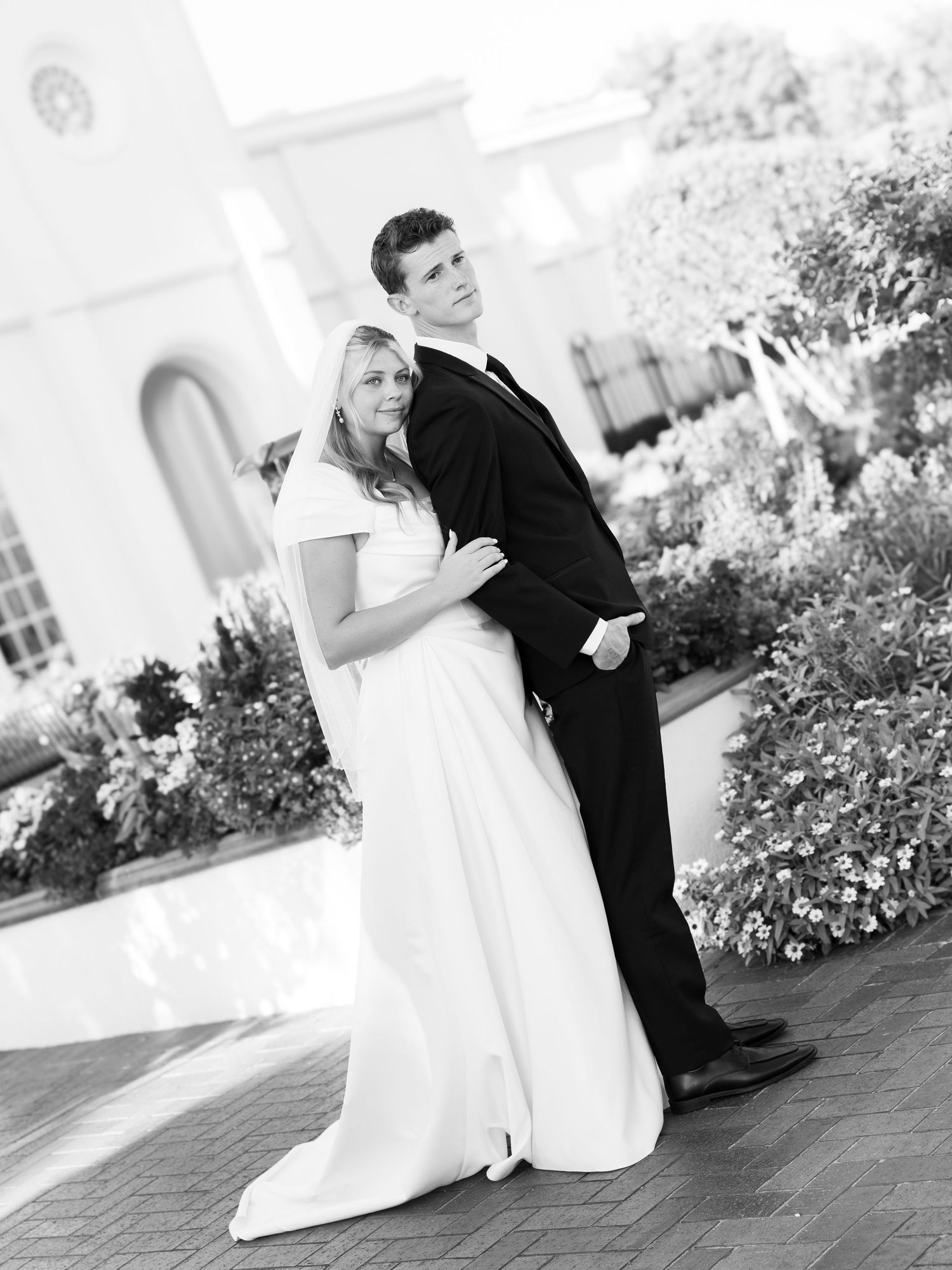 Black and white wedding portrait sequence showing a couple in elegant poses.