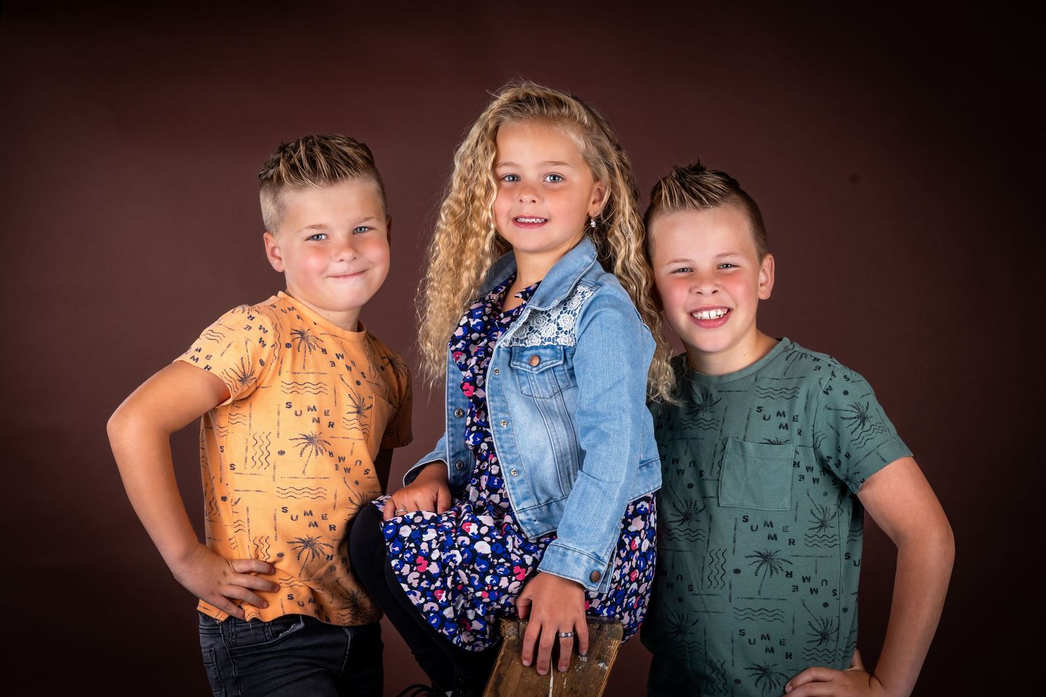 A series of six similar portrait style photos arranged horizontally showing siblings posing together.