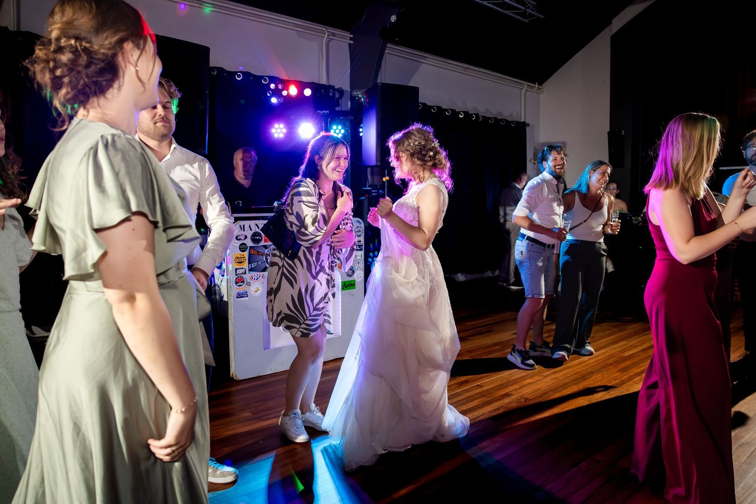 Wedding reception dance floor filled with guests enjoying the celebration.