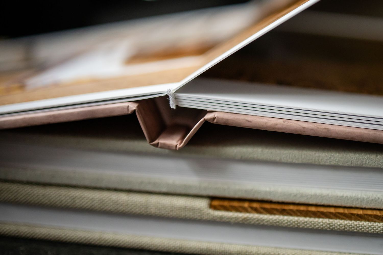 Close-up macro shot of open book pages showing binding and paper texture details.