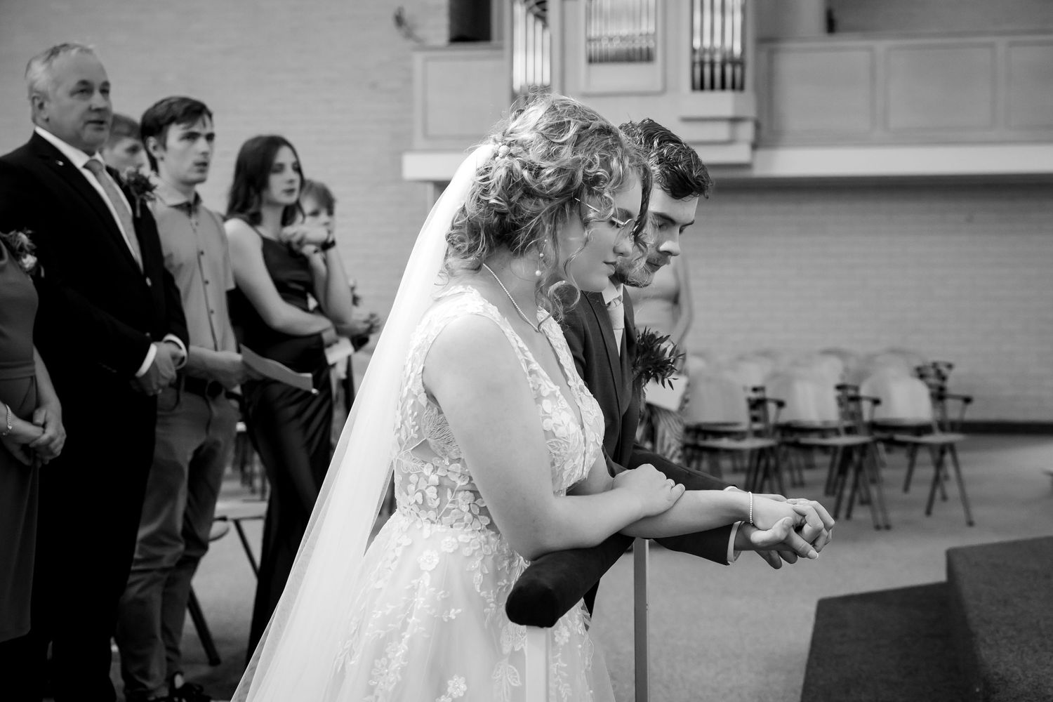 A series of intimate moments captured during a wedding ring exchange ceremony.