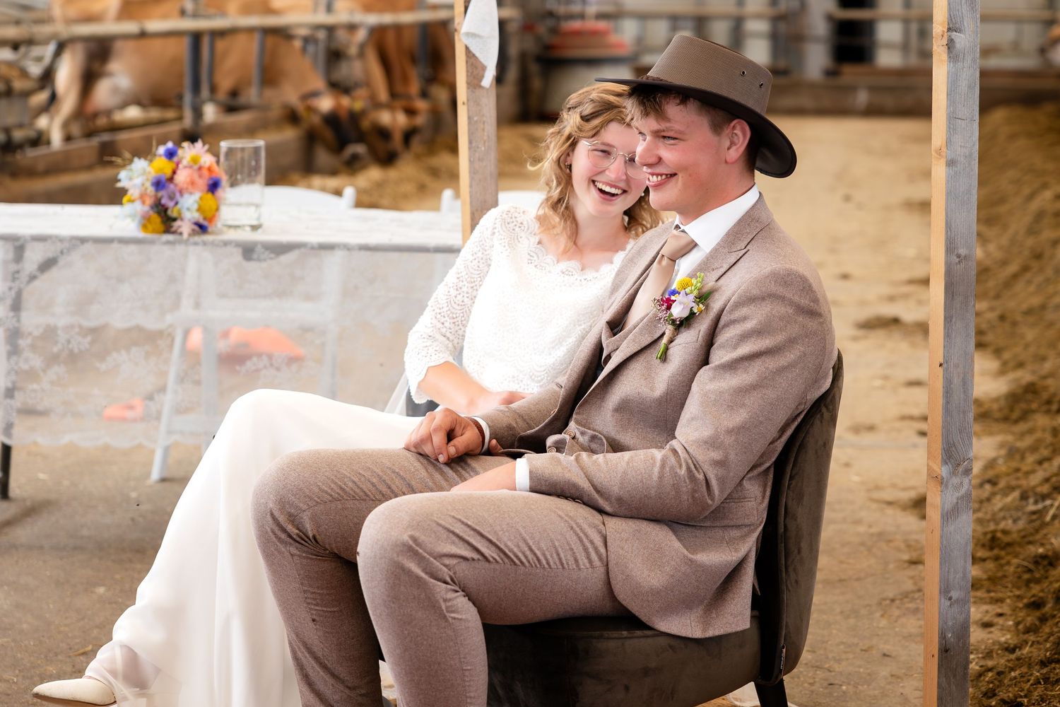 Couple sharing an intimate moment during their barn wedding celebration.