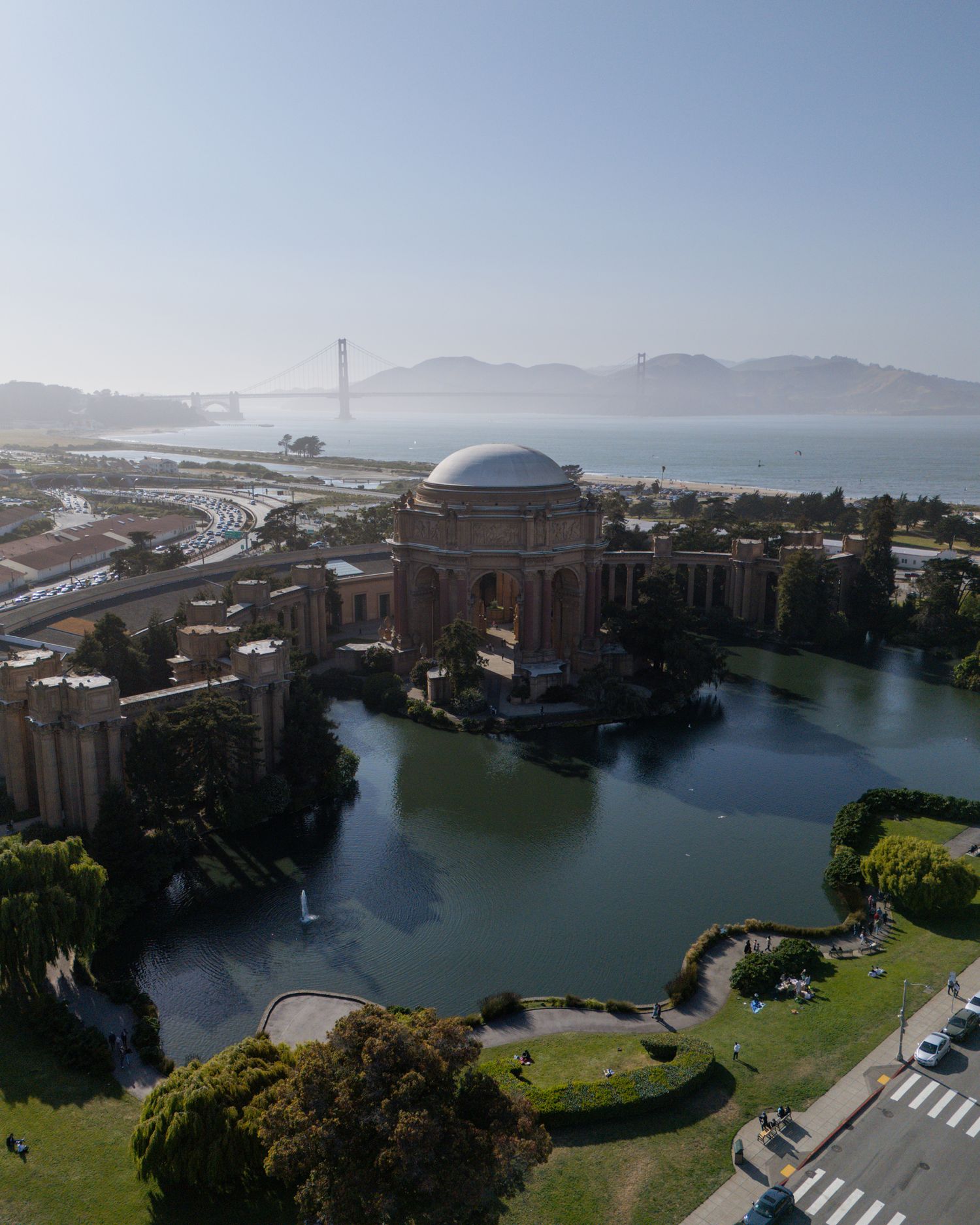 Panoramic view of the Palace of Fine Arts in San Francisco with its dome reflected in the lagoon.