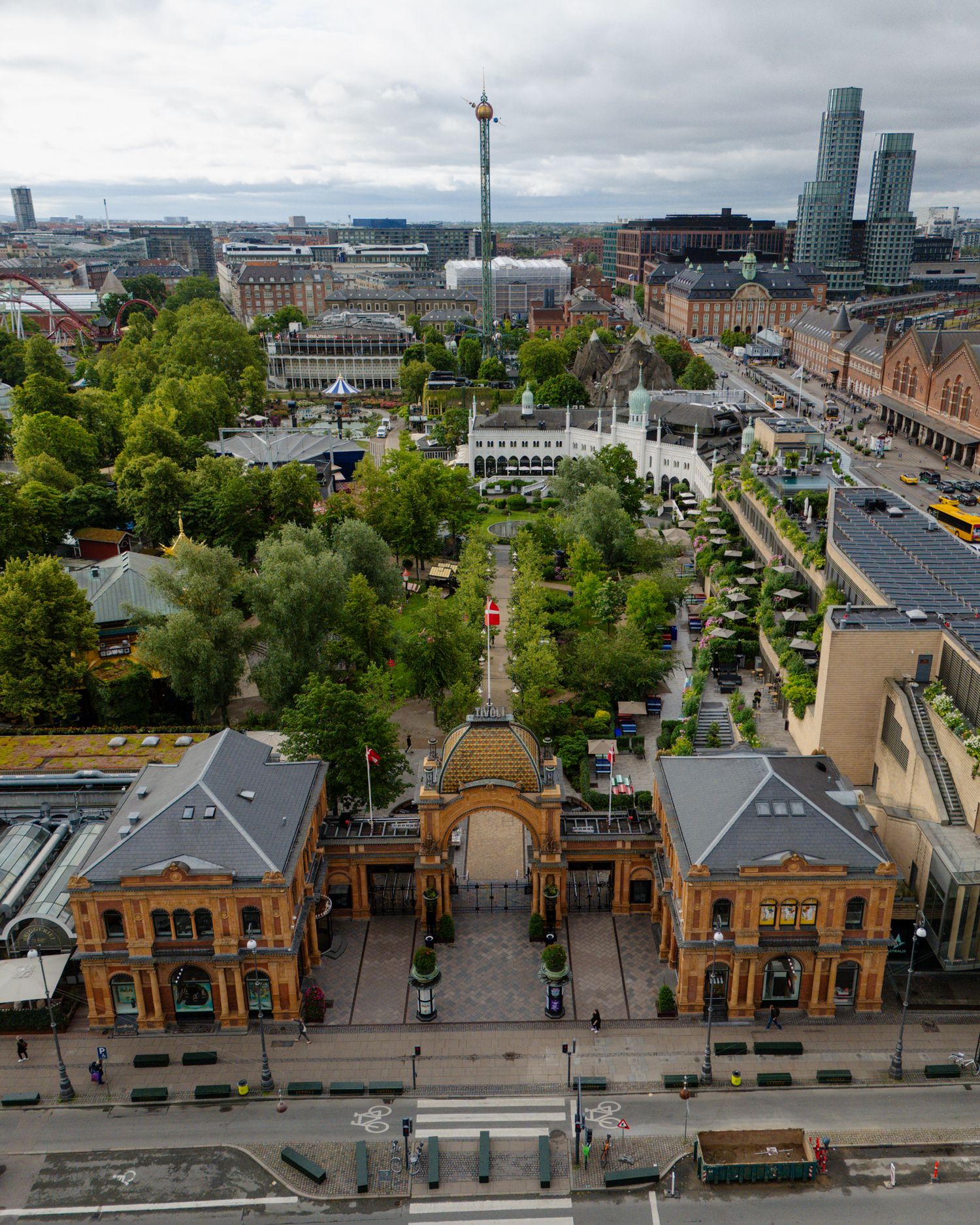 Aerial view of historic train station buildings and surrounding urban landscape.