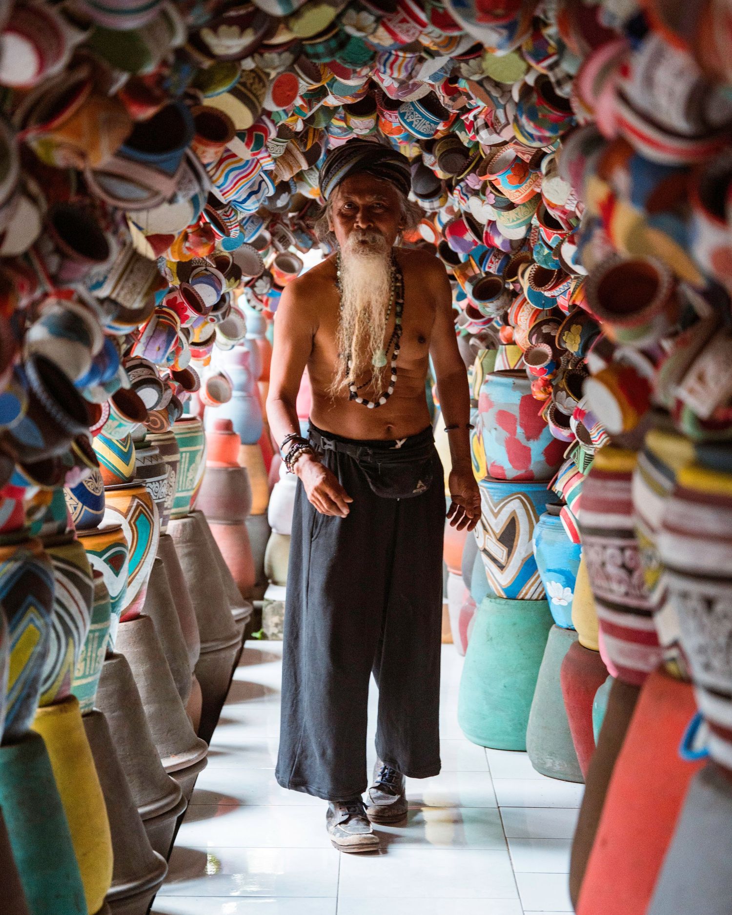 Colorful pottery workshop displaying handmade ceramic vessels in Indonesia.