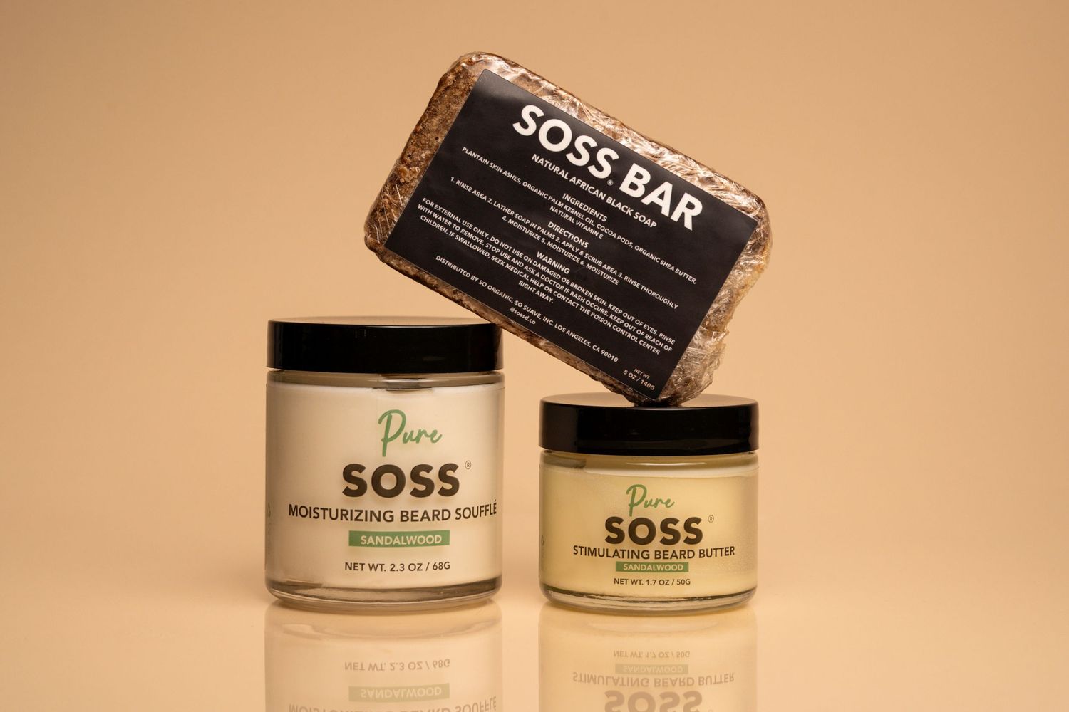 Collection of SOSS beauty product containers arranged on a beige background.