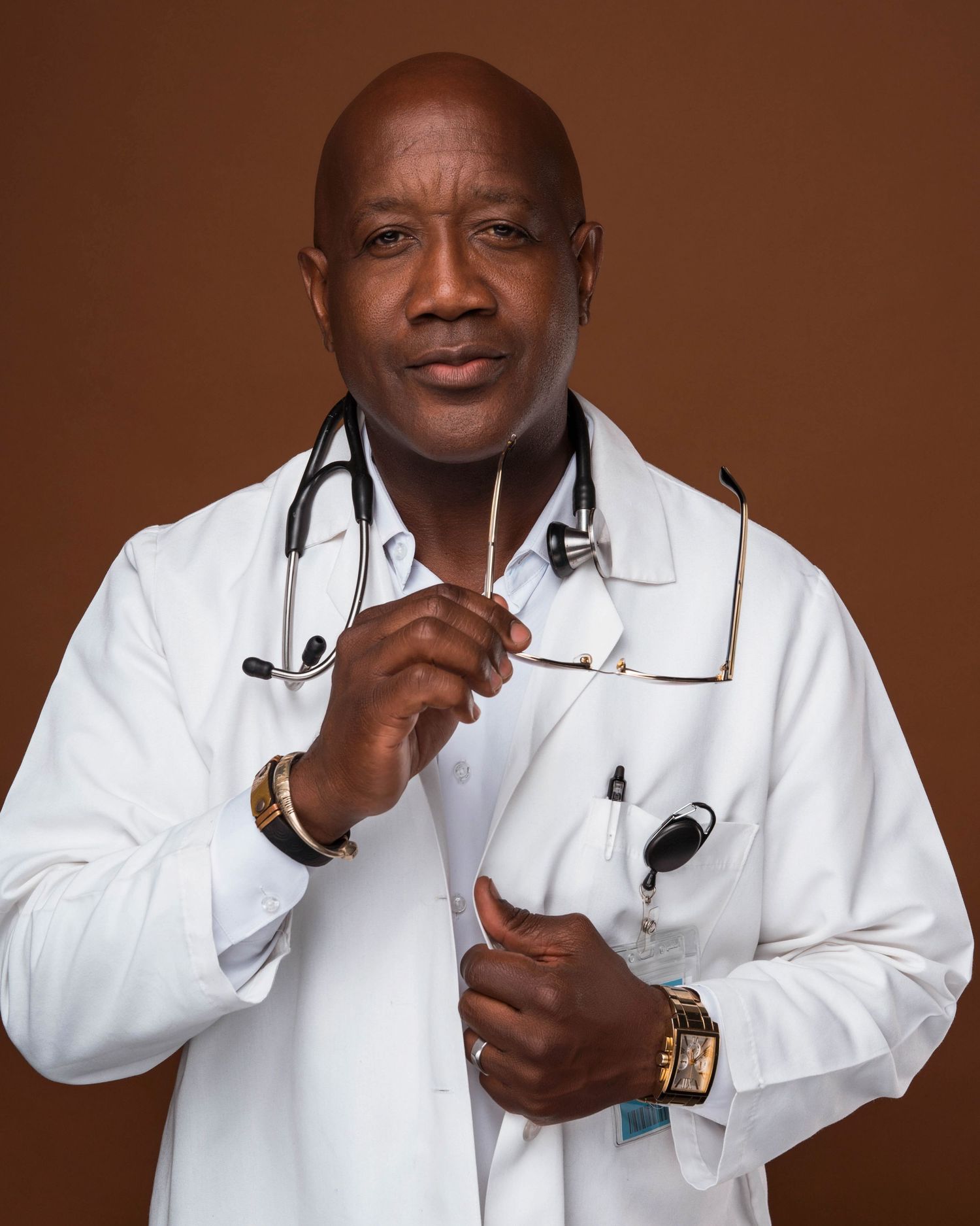 Medical professional in white coat with stethoscope posing for various portraits.