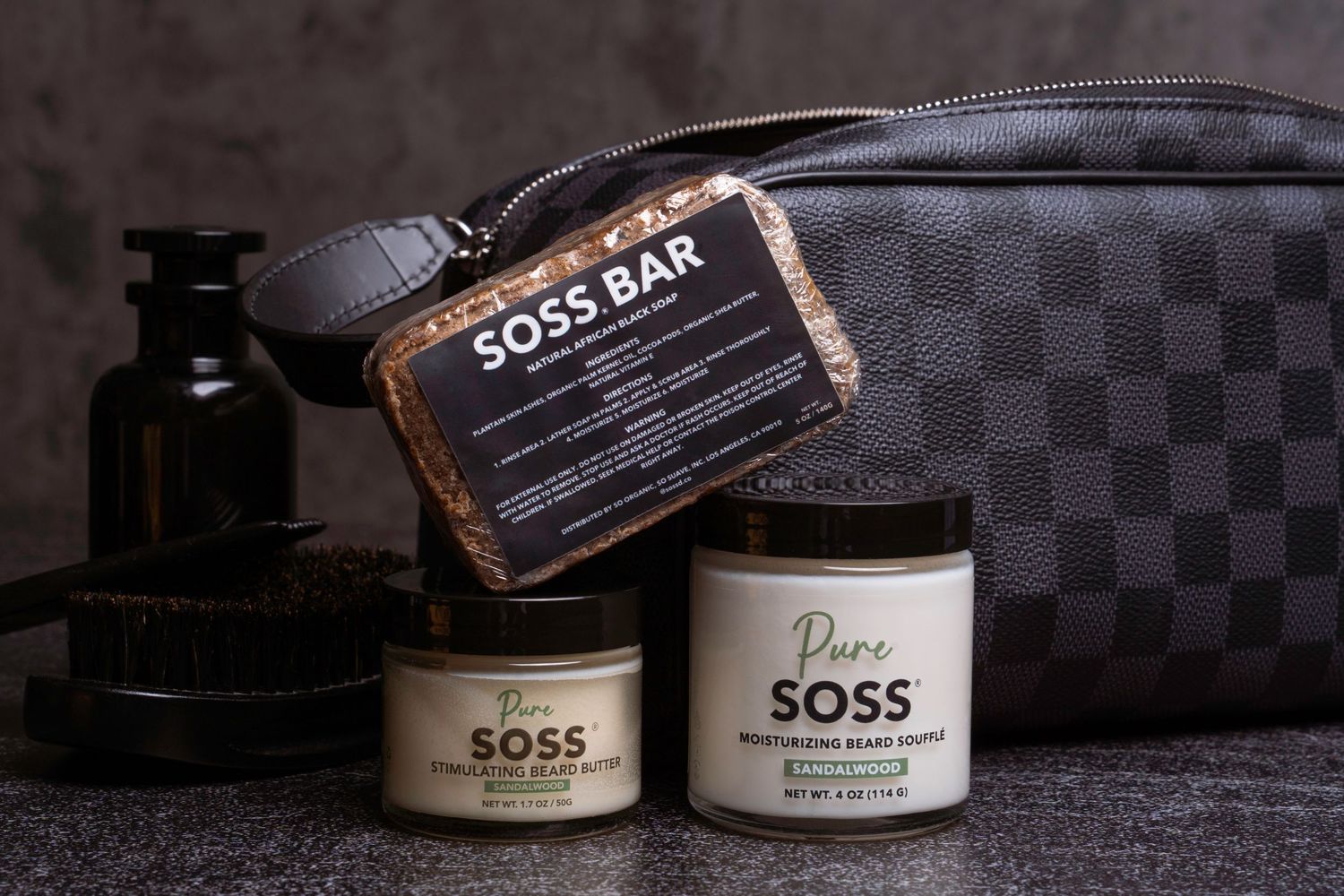 Collection of SOSS Bar premium skincare products displayed on dark textured background.
