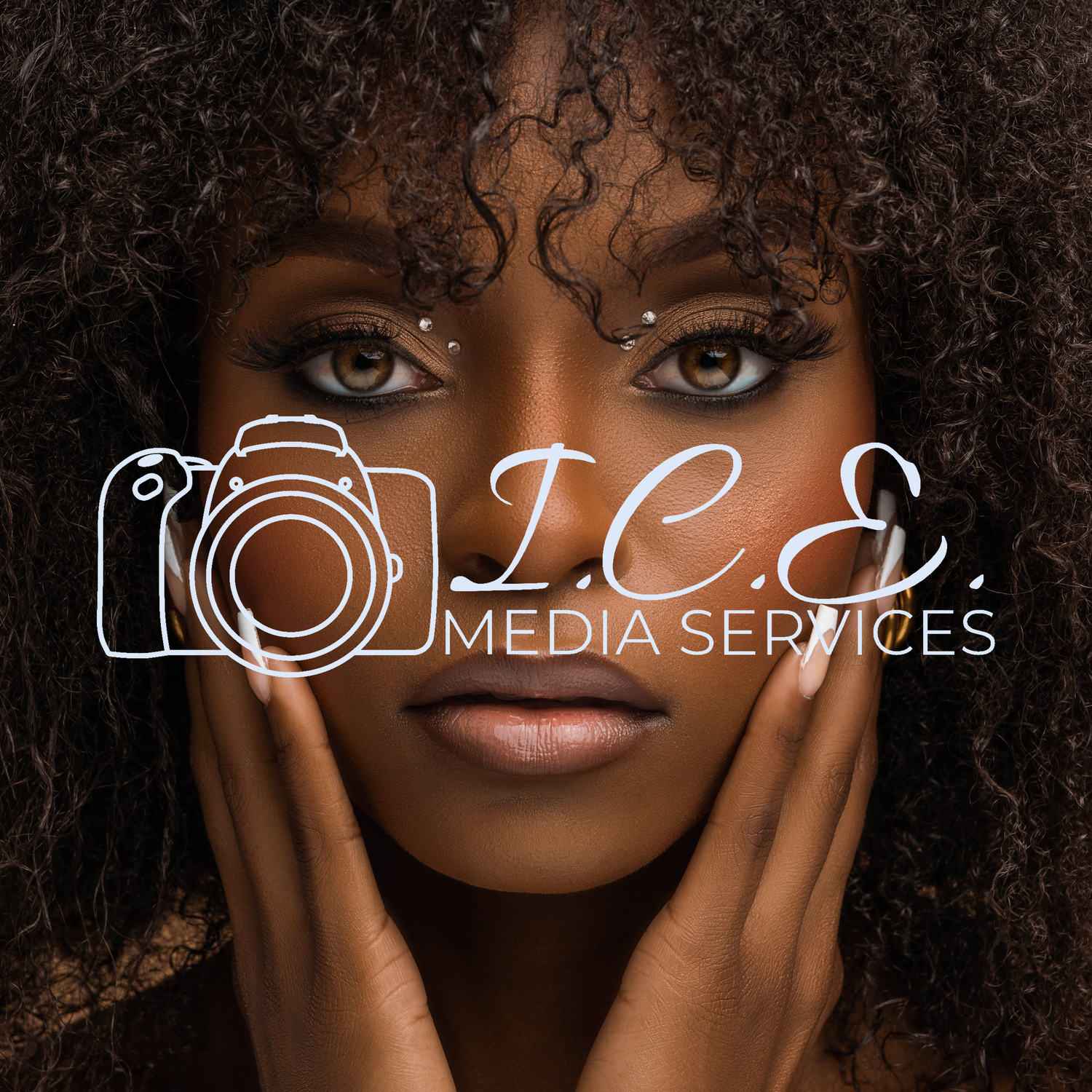 Professional studio portrait with ICE Media Services branding featuring artistic lighting and makeup.