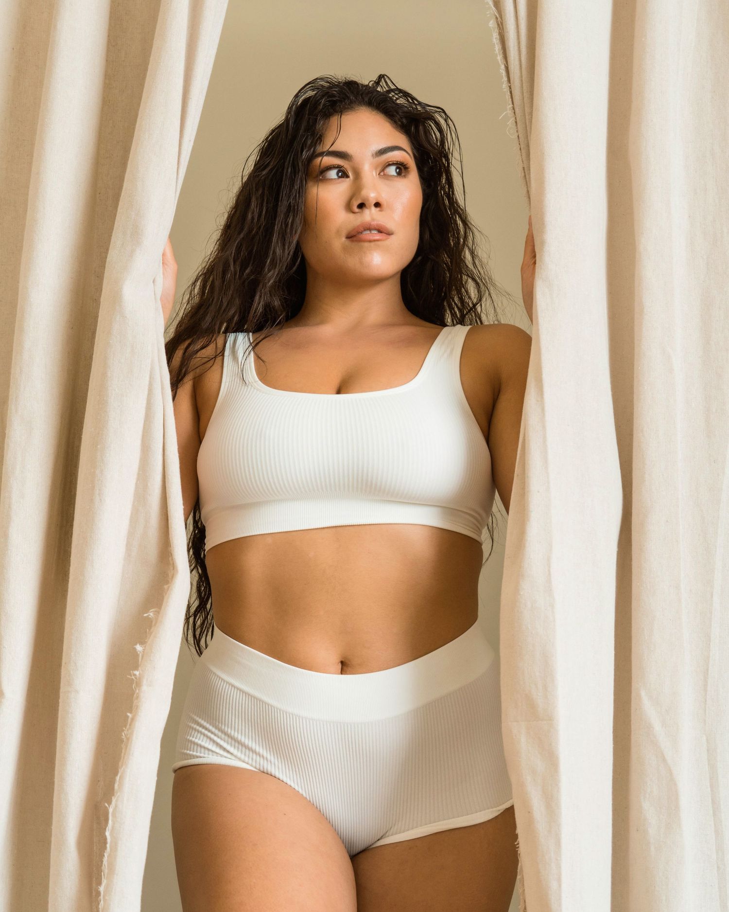 Collection of intimate portraits in white lingerie against cream curtain backdrop.