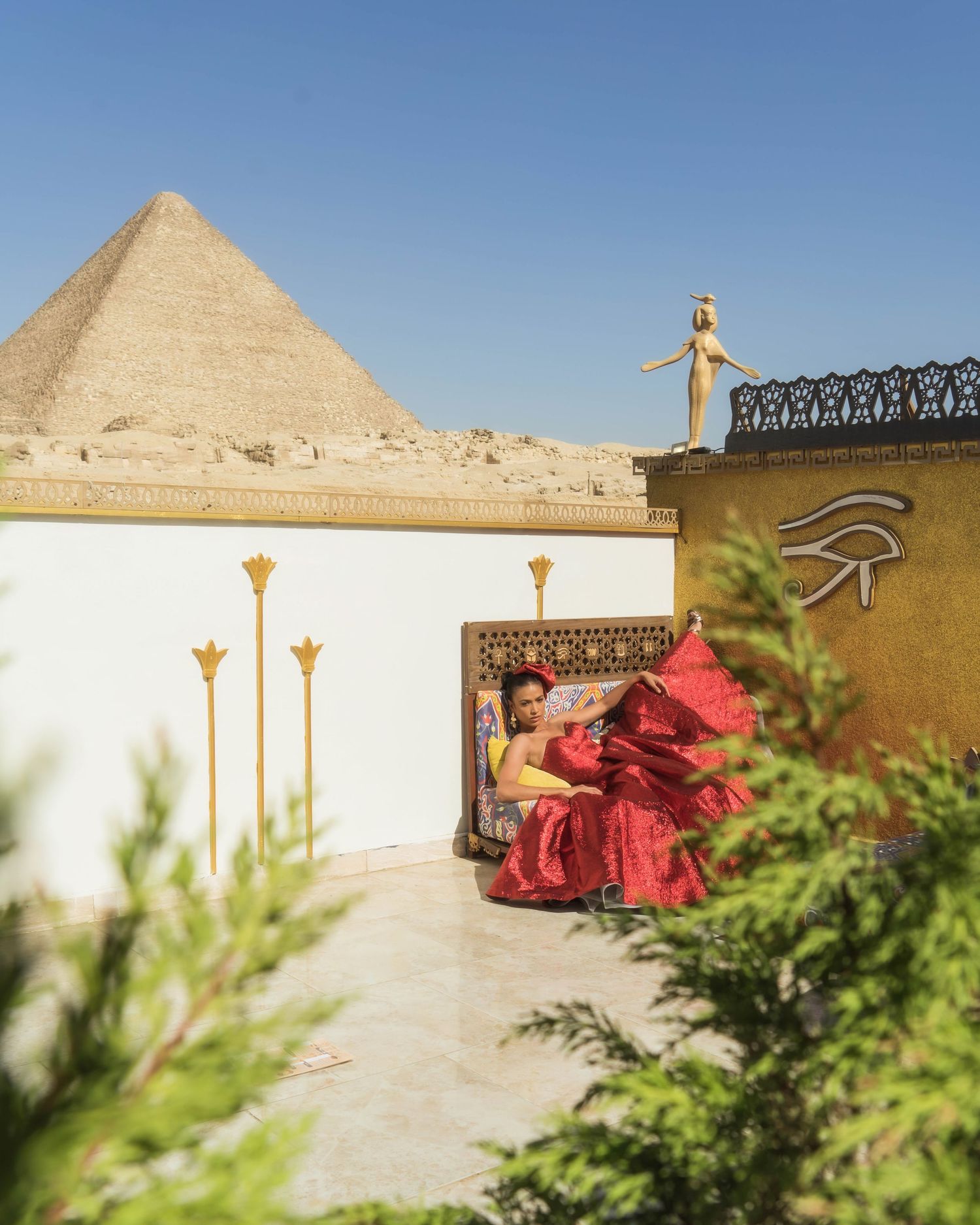 Ancient Egyptian pyramids rising majestically against clear blue sky.