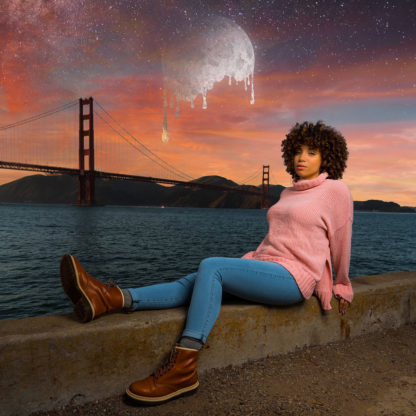 Artistic photo of a person by Golden Gate Bridge with melting moon in surreal sunset sky.