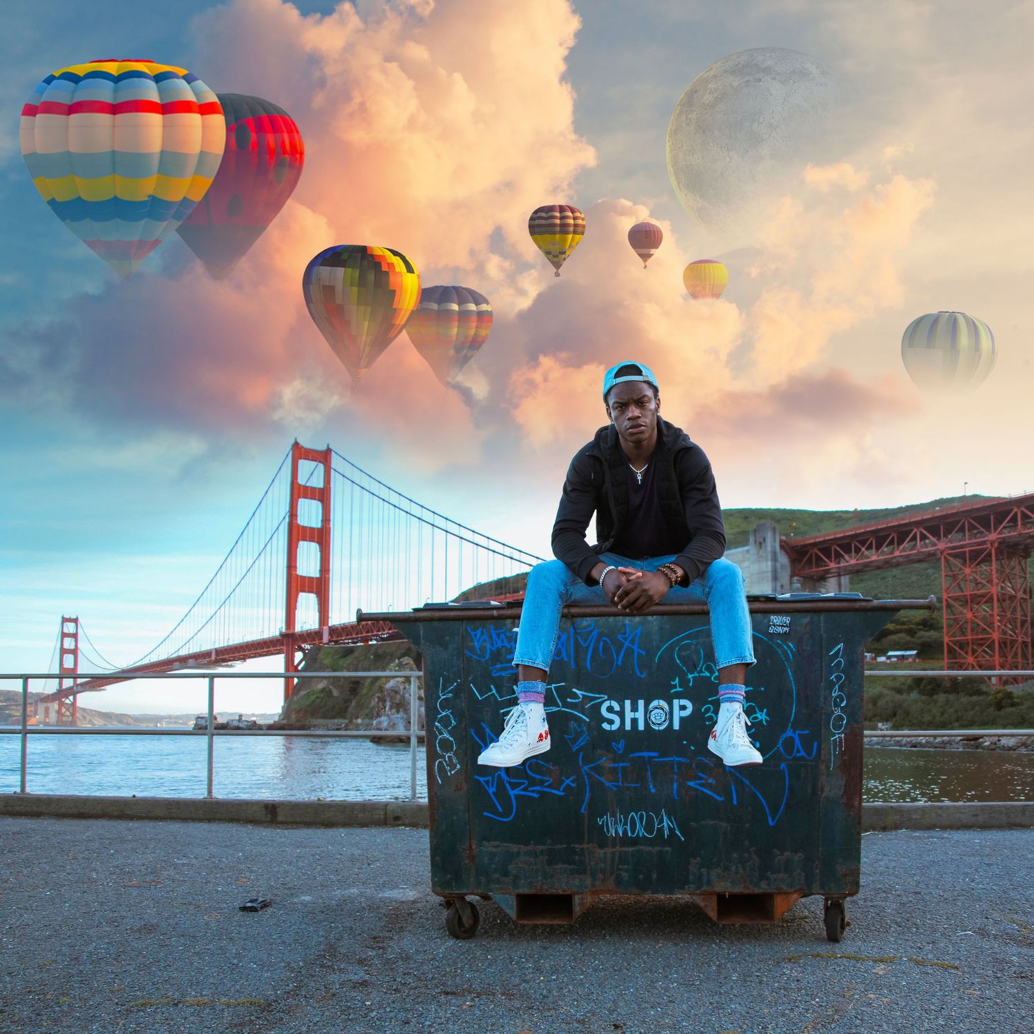 Hot air balloons float over San Francisco Bay with Golden Gate Bridge in background at sunset.